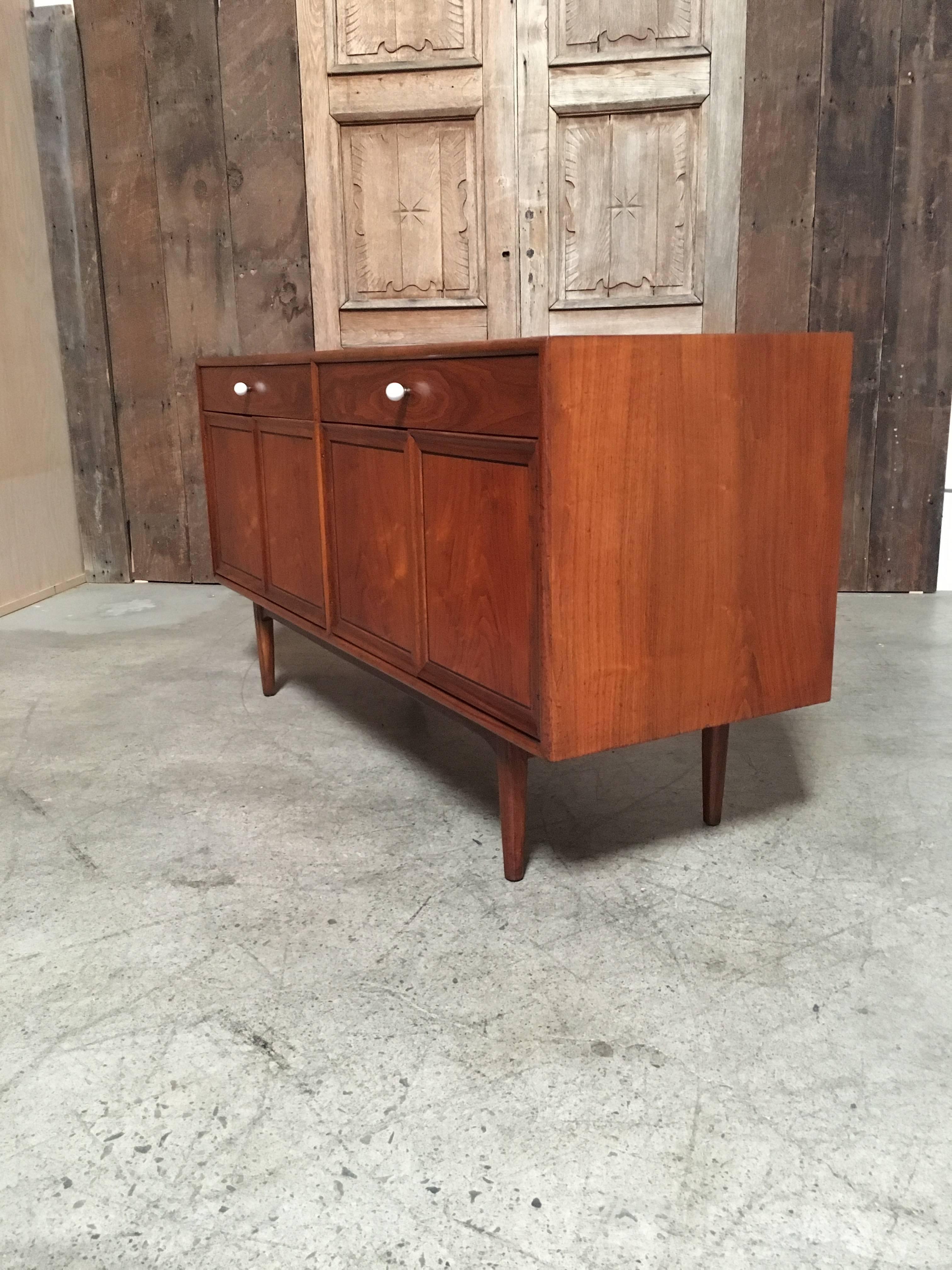 Drexel Declaration series credenza designed by Kipp Stewart with four doors and two drawers and original cue ball drawer pulls.