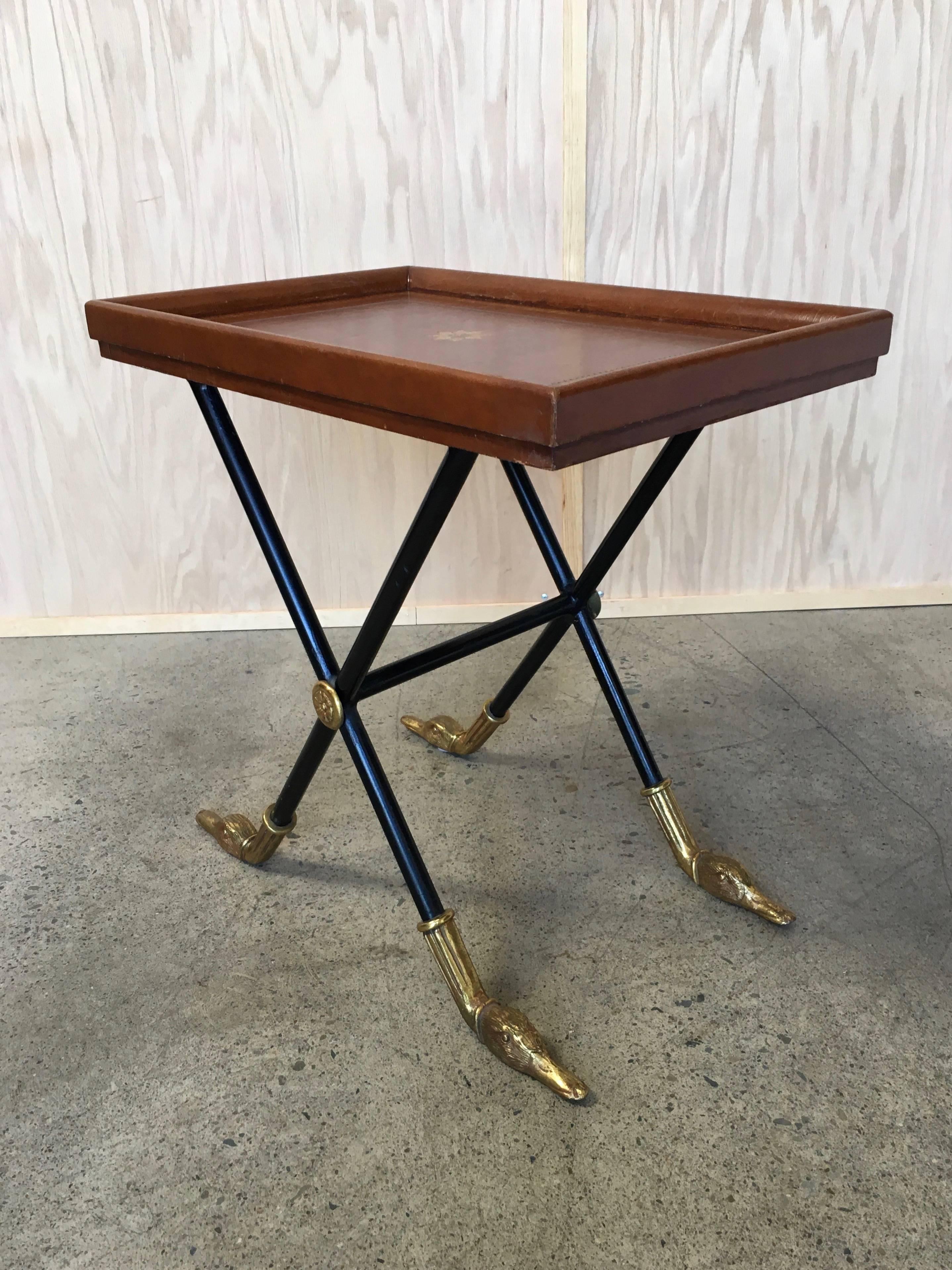 Maitland Smith side Table with distressed leather and brass accents with duck head for feet.