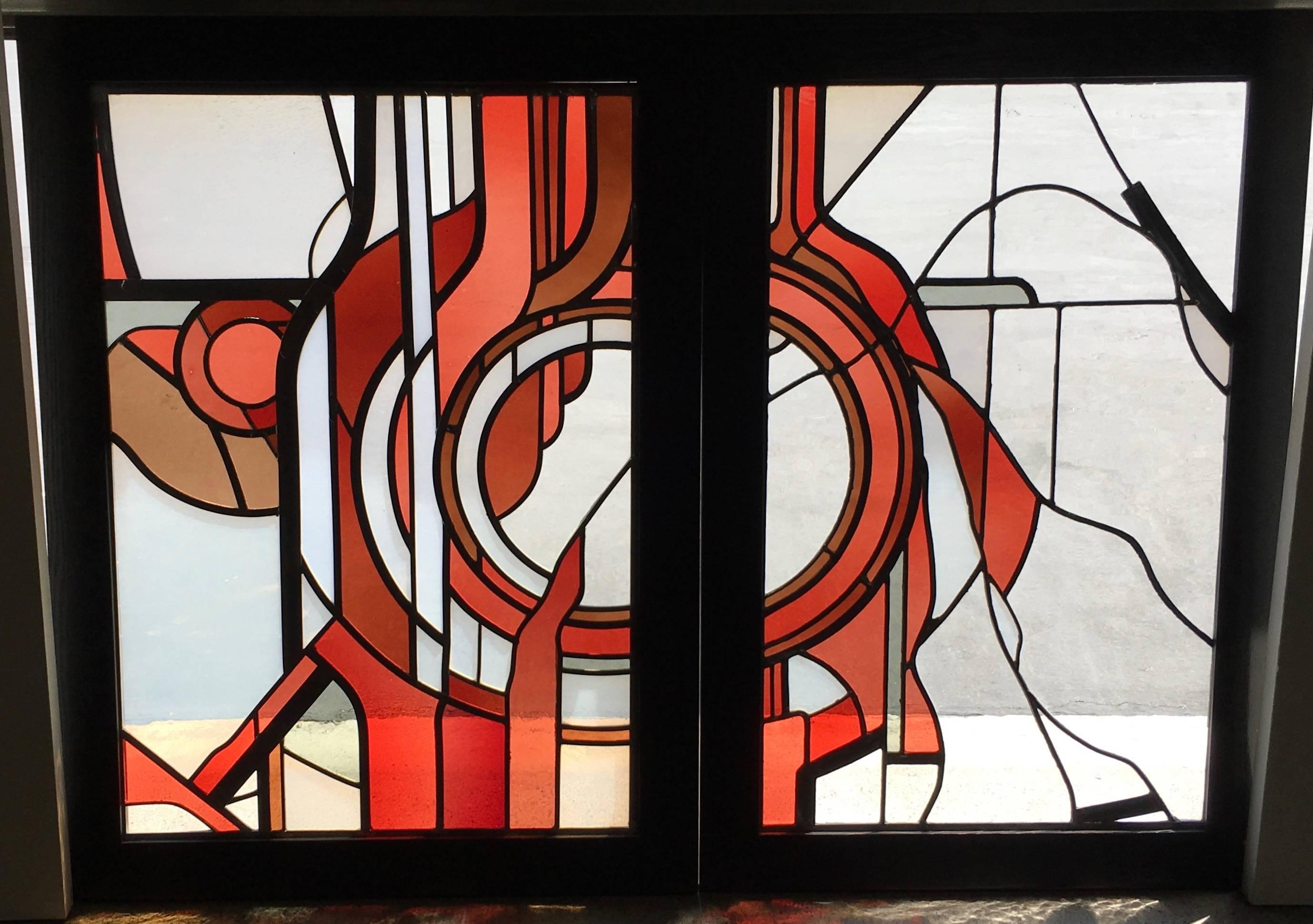 Studio crafted stained glass abstraction. These pieces have been custom framed for display.

Two panels measures: 30.5