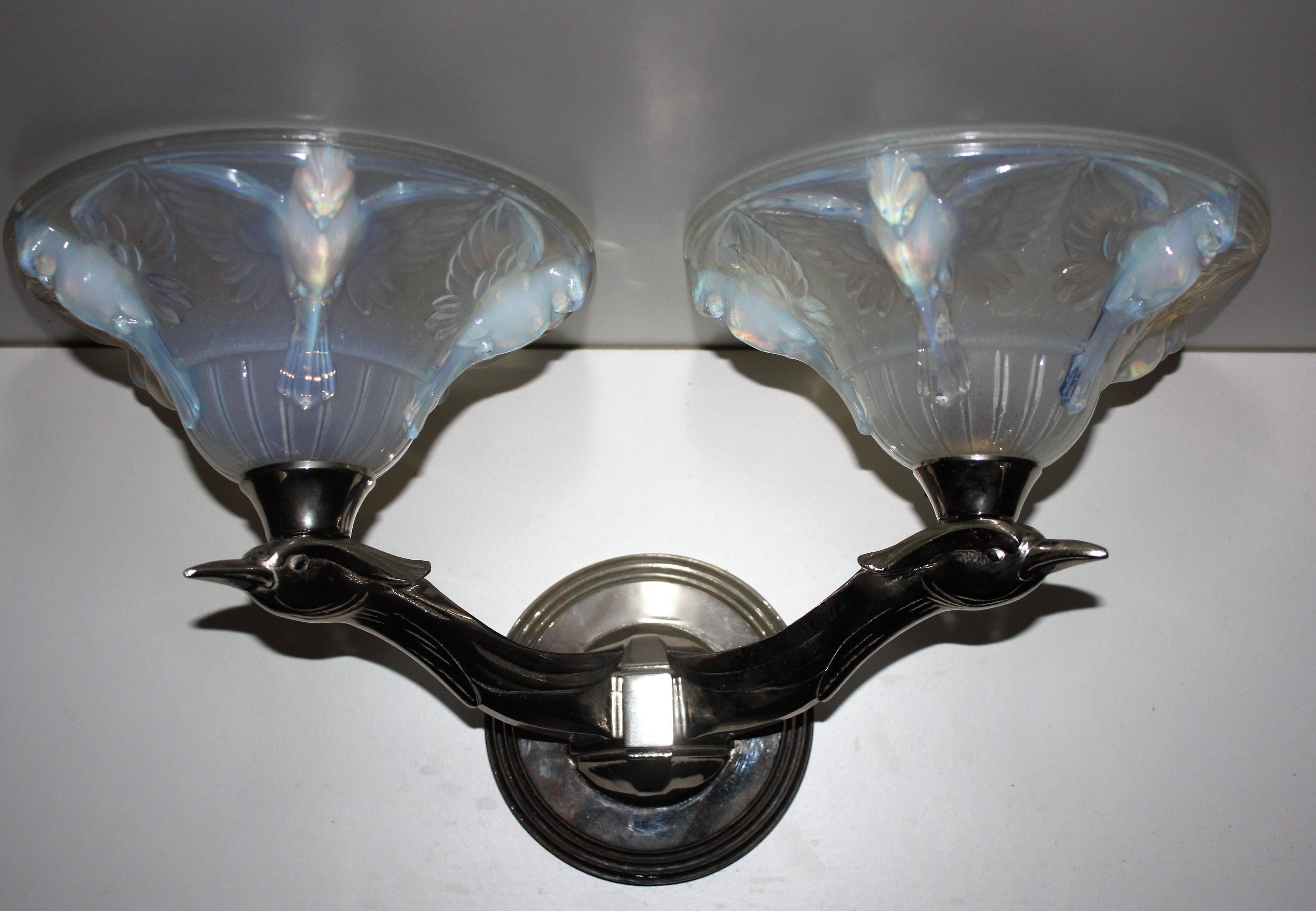 Stunning pair of French wall sconces, nickeled soild bronze frame and opalescent glass shades , signed -LA
Excellent condition.