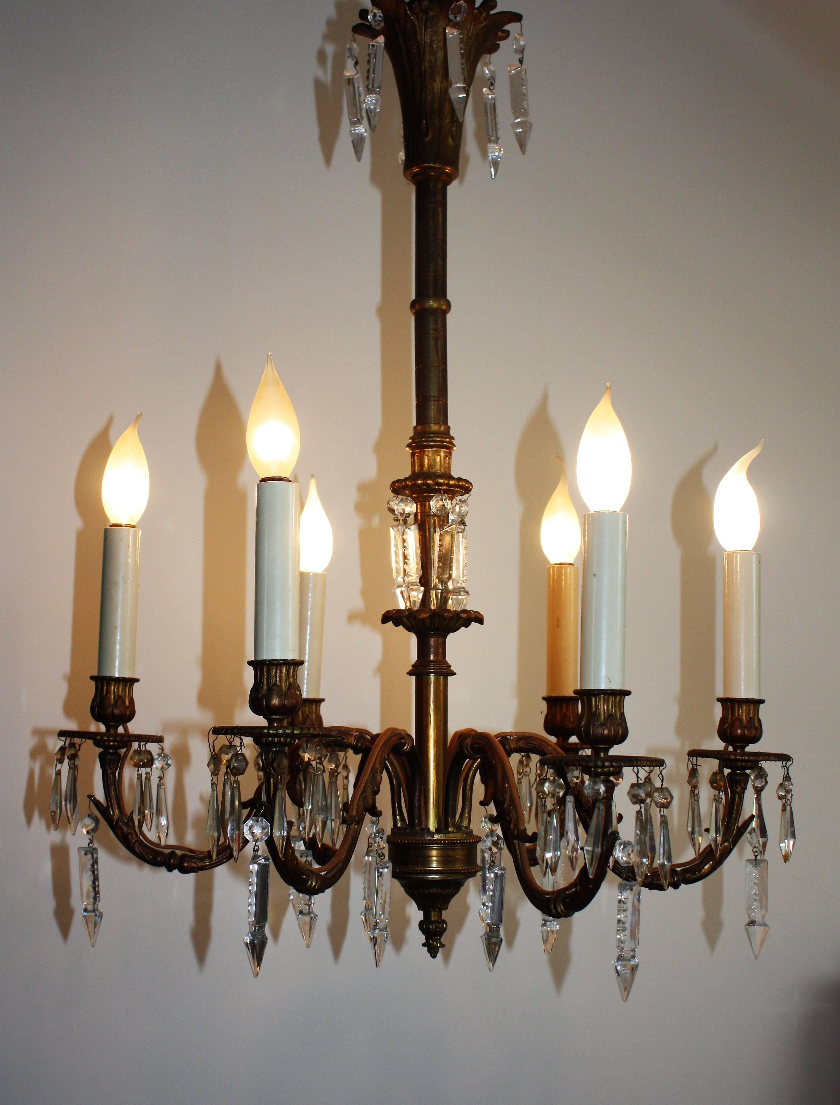 Wonderful antique bronze six-light chandelier with crystal decoration, late 19th century.
Electrified in the 1930s for six x e 14 socket.
Very elegant and with wonderful patina.
Weight: 7.2 kilo - 15.8 ibs.
 