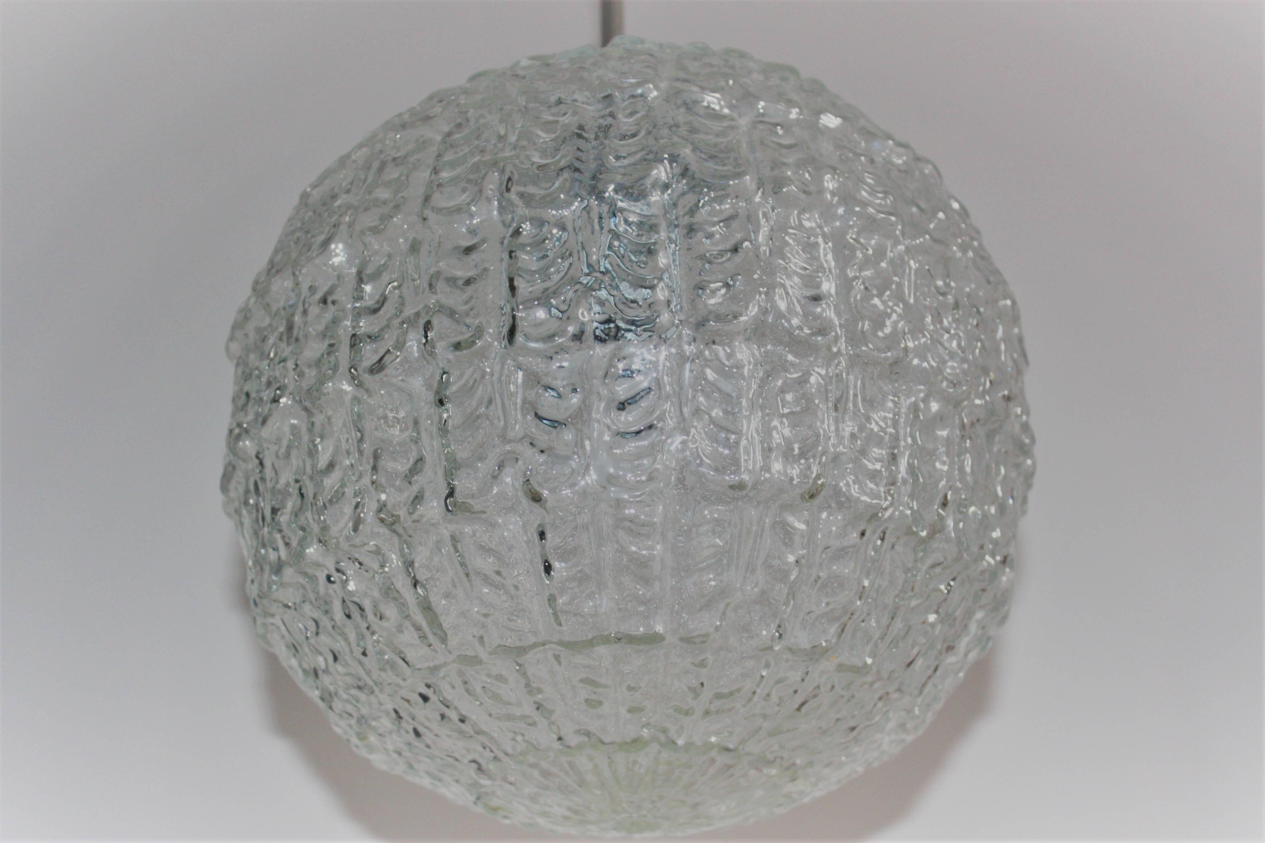 Mid-Cenutry Modern pendant, with textured glass shade and chrome elements.
Limburg, Germany, circa 1960s.
Socket: 1 x e 27 for standard screw bulbs 
Very good condtion.