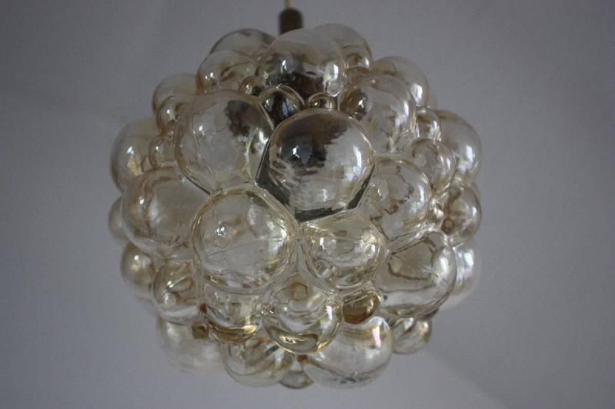 Small glass pendant designed by H.Tynell for Limgurg, Germany, circa 1960s.
Bubble glass and brass.
Socket: e27  for standard screw bulbs
Very good condition.