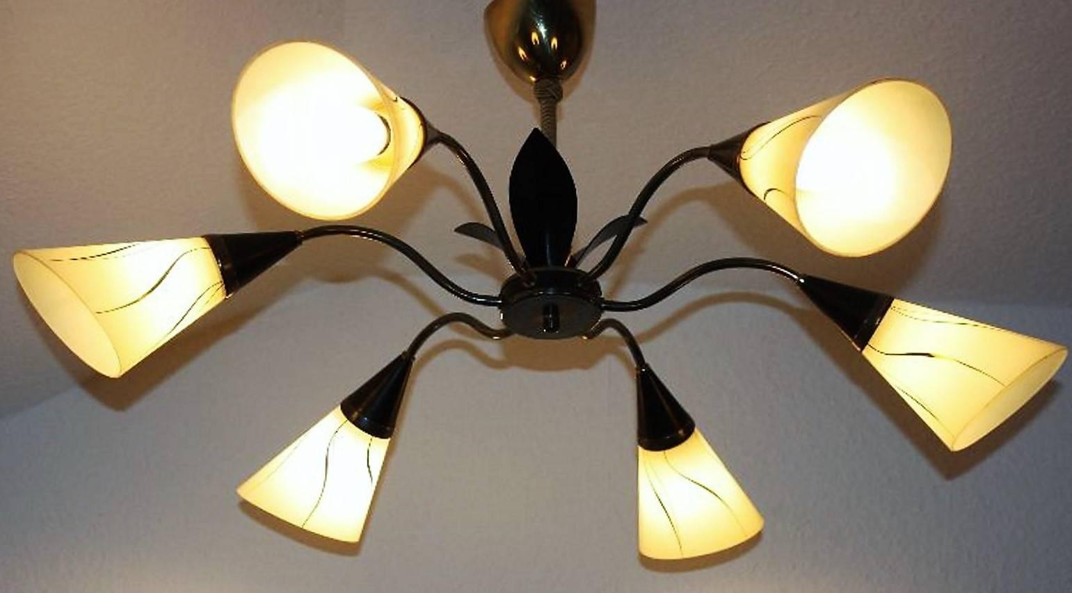 Mid-Century Modern "Sputnik" chandelier, Germany, circa 1950s.
Six-light black lacquered metal and brass frame with six opal glass shades.
Socket: Six x Edison (e14) for standard screw bulbs.
Excellent condition.