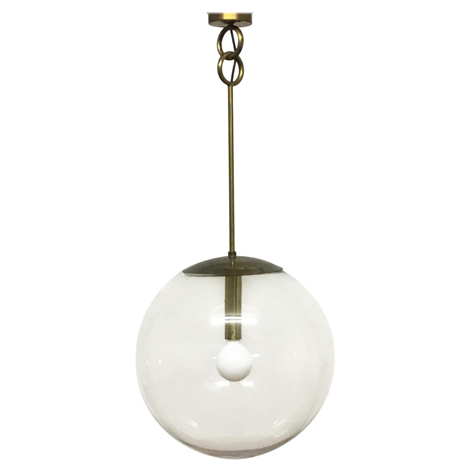 An extra large mid -century glass globe (20.47 inches in diameter ) pendant hanging on brass attr. to Geateno Sciolari, Italy, circa 1960s.
Diameter: 20.47 inches 
Socket: 1 x Edison E27 or E26 (US) for standard screw bulb.
The condition is