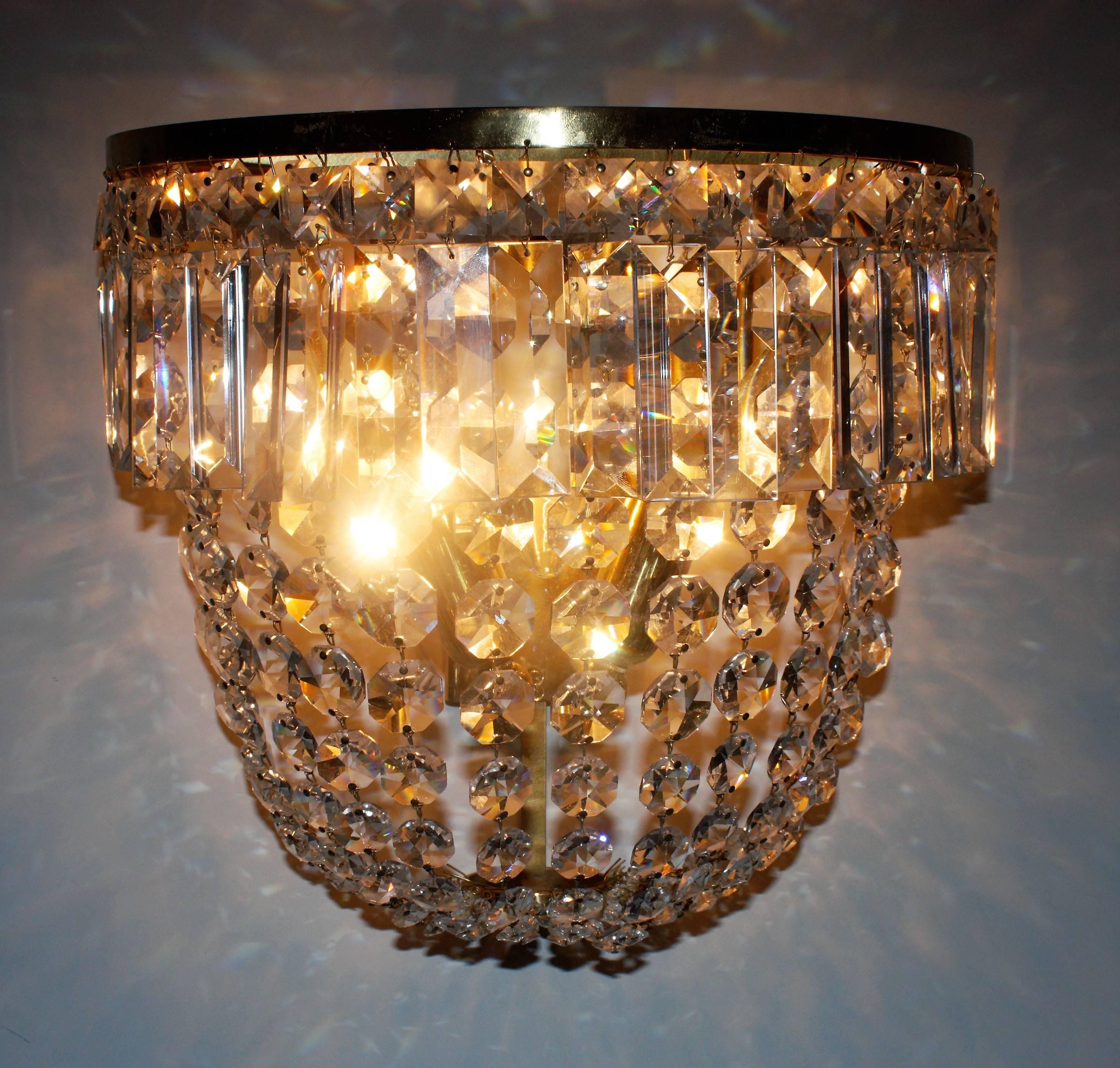 Grand pair of stunning high quality three-light handcrafted wall sconces by high- end manufacture Ernst Palme (Palwa), Germany, circa 1960s.
Beautiful hand-cut crystal on a gilt brass frame.
Both sconces are cleaned and in a very good condition