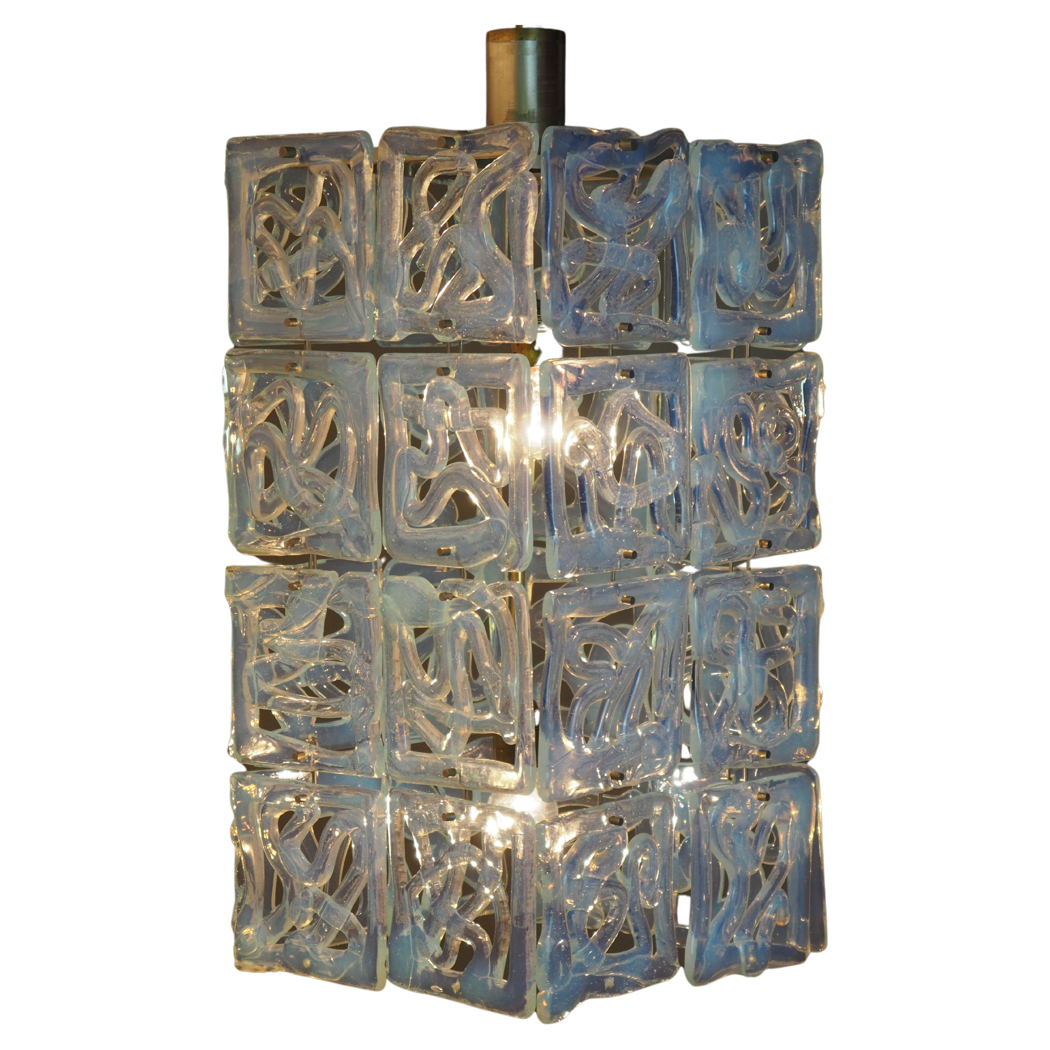 An extraordinary and very rare midcentury Murano glass pendant attributed to Carlo Nason for Mazzega, Italy, circa 1960s.
This amazing chandelier was handcrafted of chromed brass and 32 x large (5.9 inch x 5.9 inch) opalescent square glass
