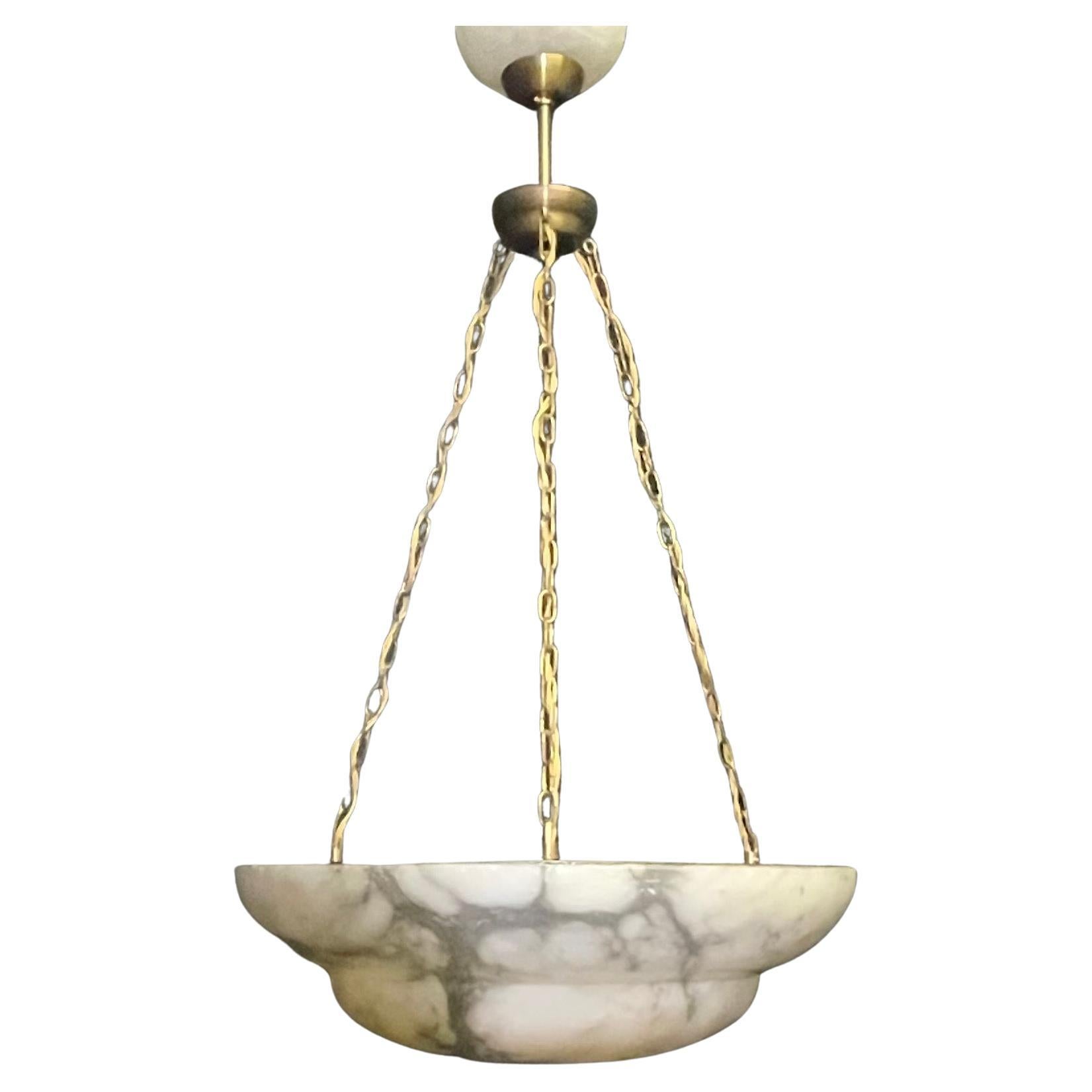A beautifully marbled large alabaster bowl pendant ( France, circa 1925) with a newly made solid burnished brass mount.
Socket: 3 x E27 or E26 (for Us standards).
Diameter: 20.47 inches.
Weight: ca. 26.45 Ibs.