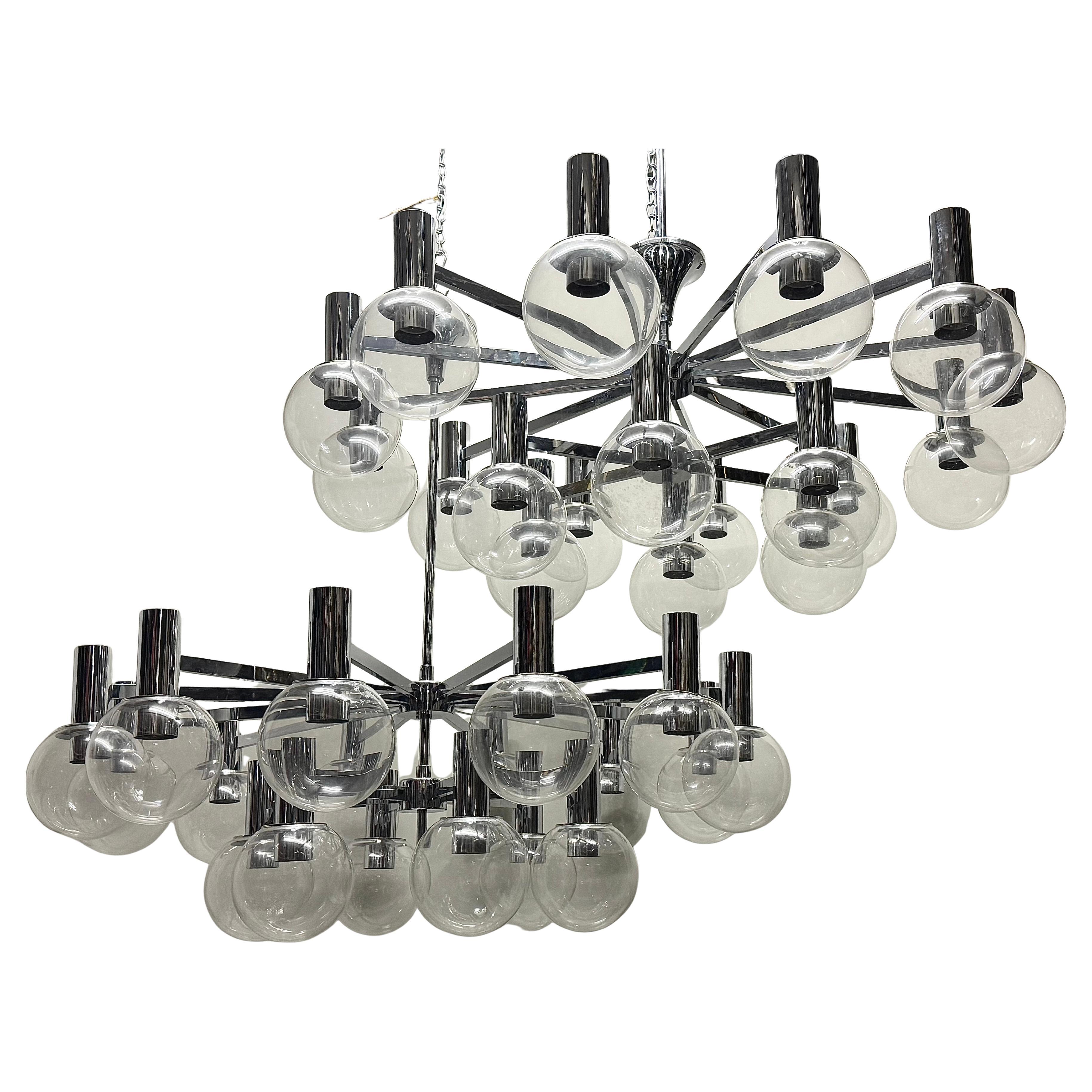 Pair of extra large and absolutely amazing eighteen-light chandeliers by Glashütte Limburg, Germany, circa 1970s.
These impressive, hight-quality chandeliers are made of nickeled brass and blown glass globes.
Socket: each 18 x e27 or e26 (US)) for
