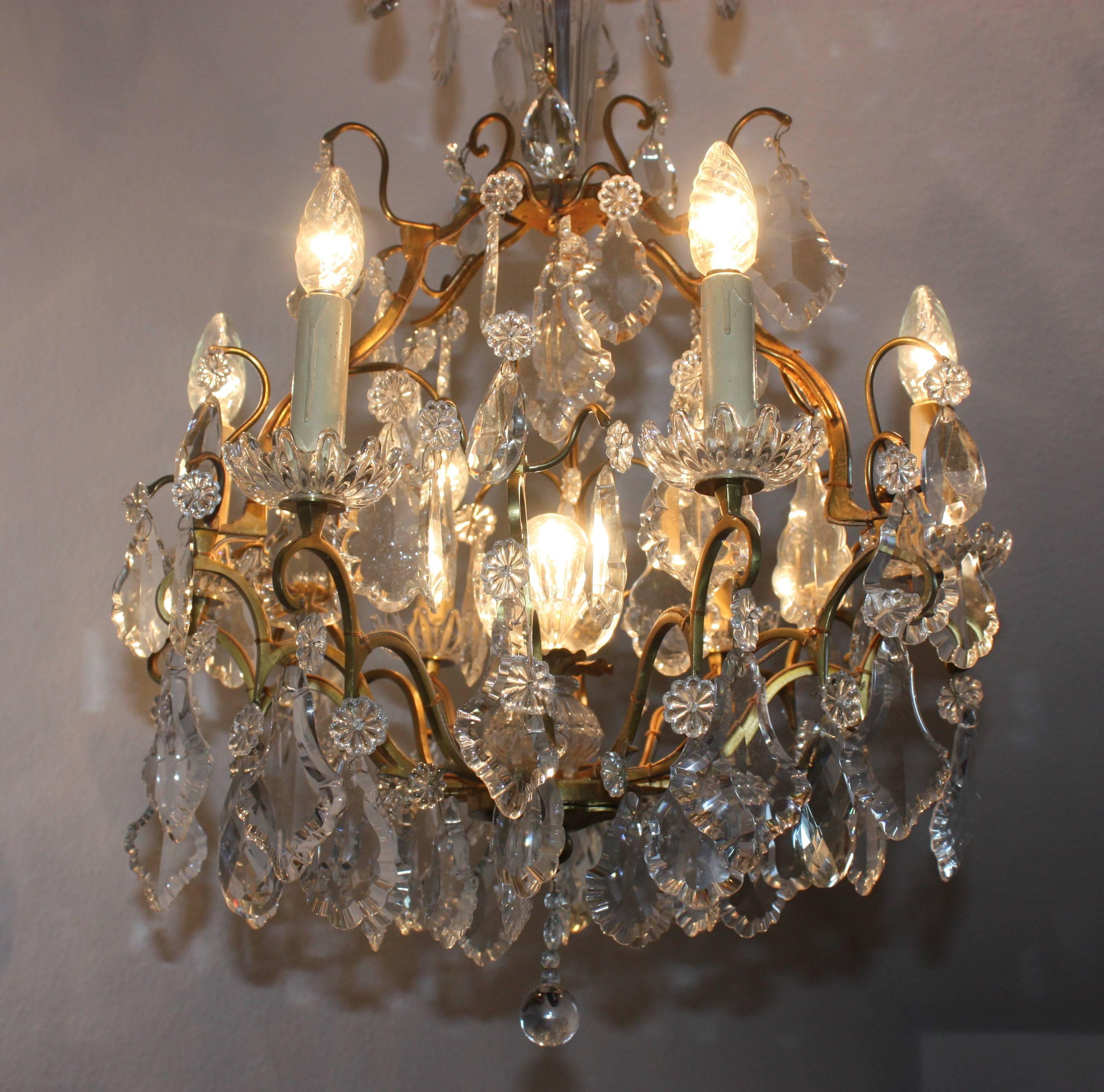 An very elegant six-arm (light) gilt bronze and crystal chandelier,
France, Art Deco, circa 1940s.
