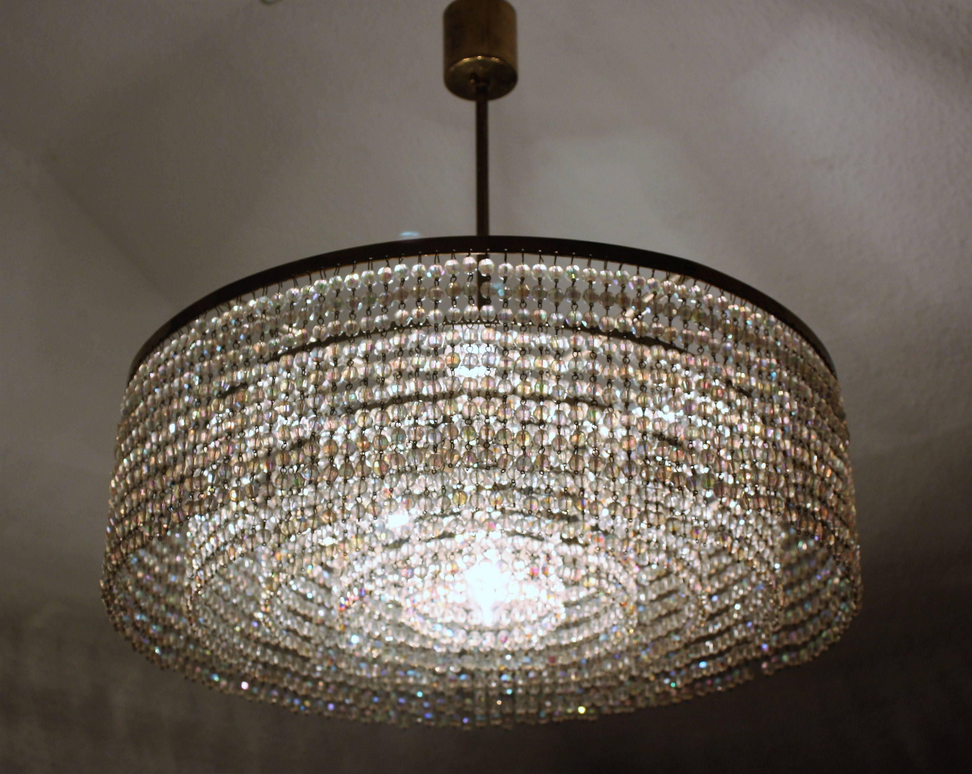 Large six-light chandelier with 3270 multicolor hand-cut crystal pearls on the five-tiered brass frame.
In very good vintage condition and wonderful patina.