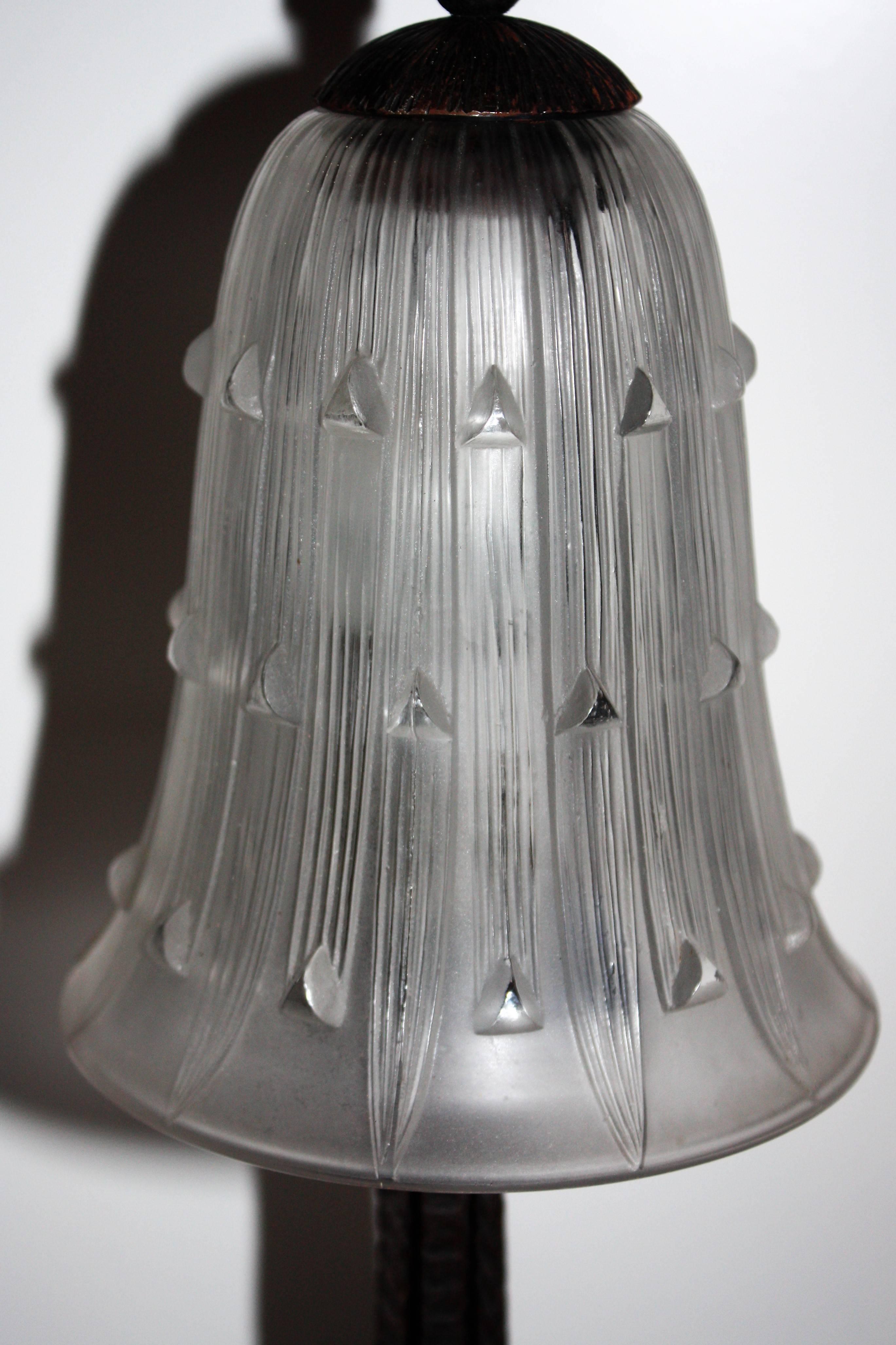 Beautiful table lamp on iron frame with bellis glass shade by Rene Lalique, France, circa 1920s glass without signature.
 