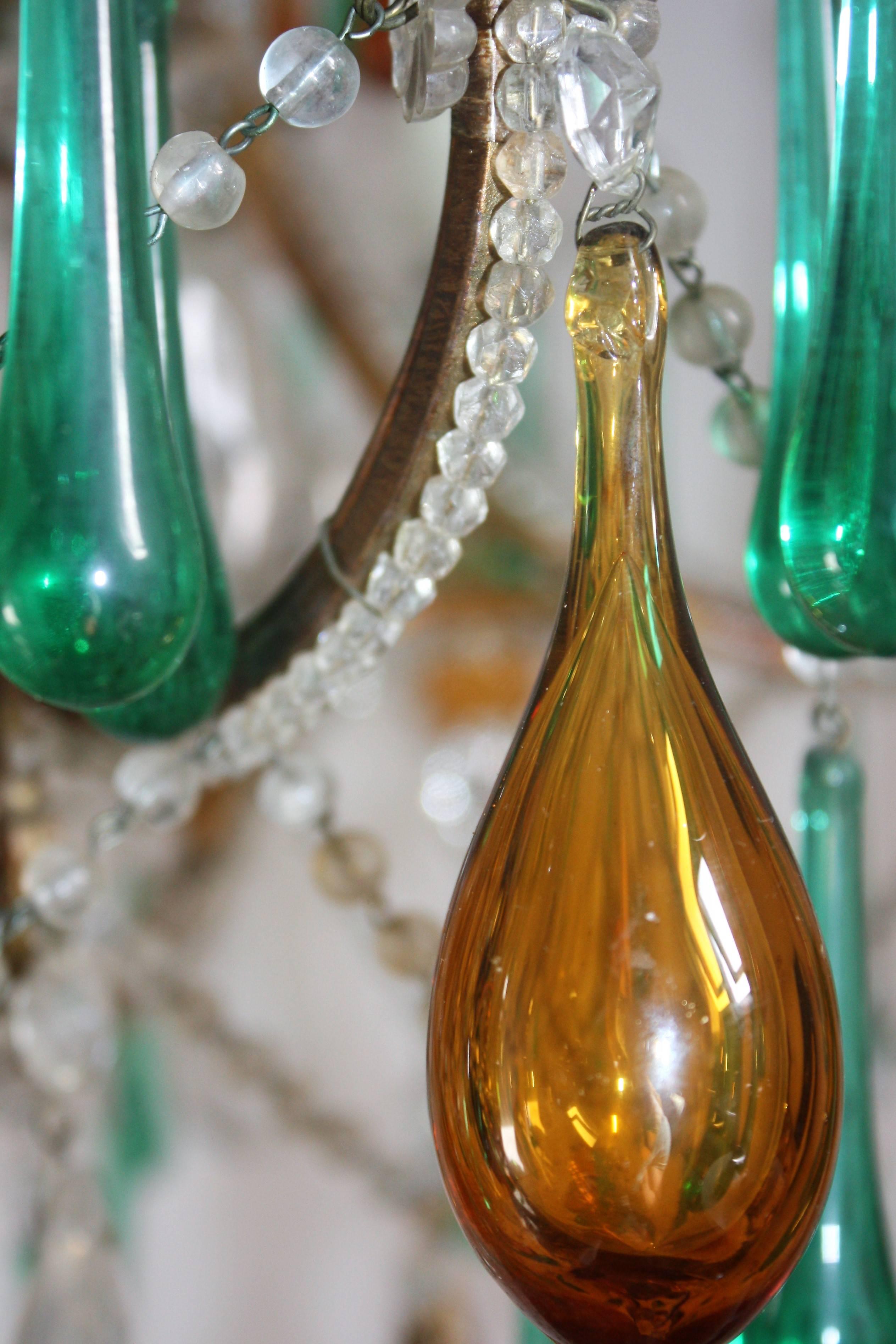 Beautiful and large six-light chandelier with green and amber color glass drops on painted iron frame, Italy, circa 1950s.
Socket: Six x e14.
Very good condition.