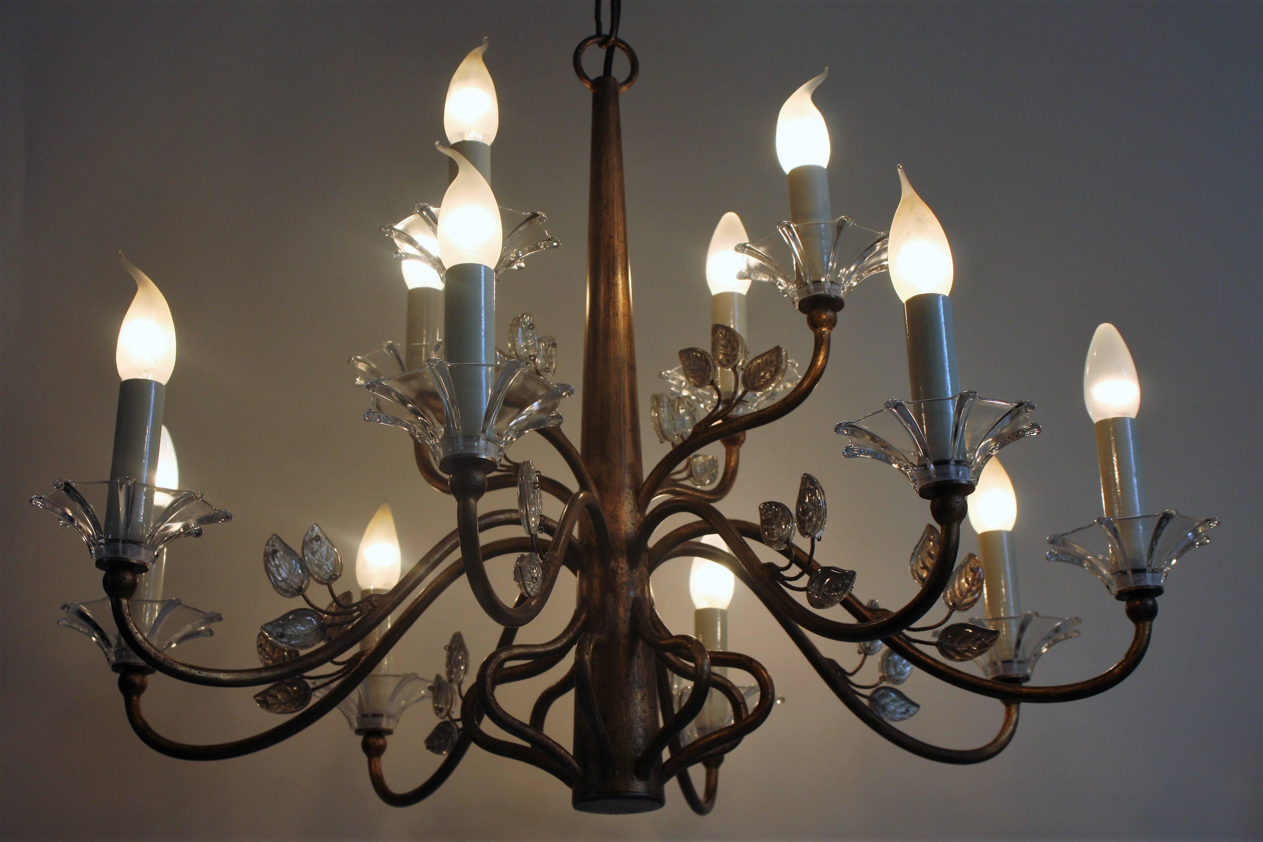 Wonderful and large Mid-Century chandelier by Giovanni Banci, Italy, 1970s.
Twelve-light gilt iron frame and Murano cleared glass.
Adjustable in the high.
Socket: 12 x e14.
Excellent condition.