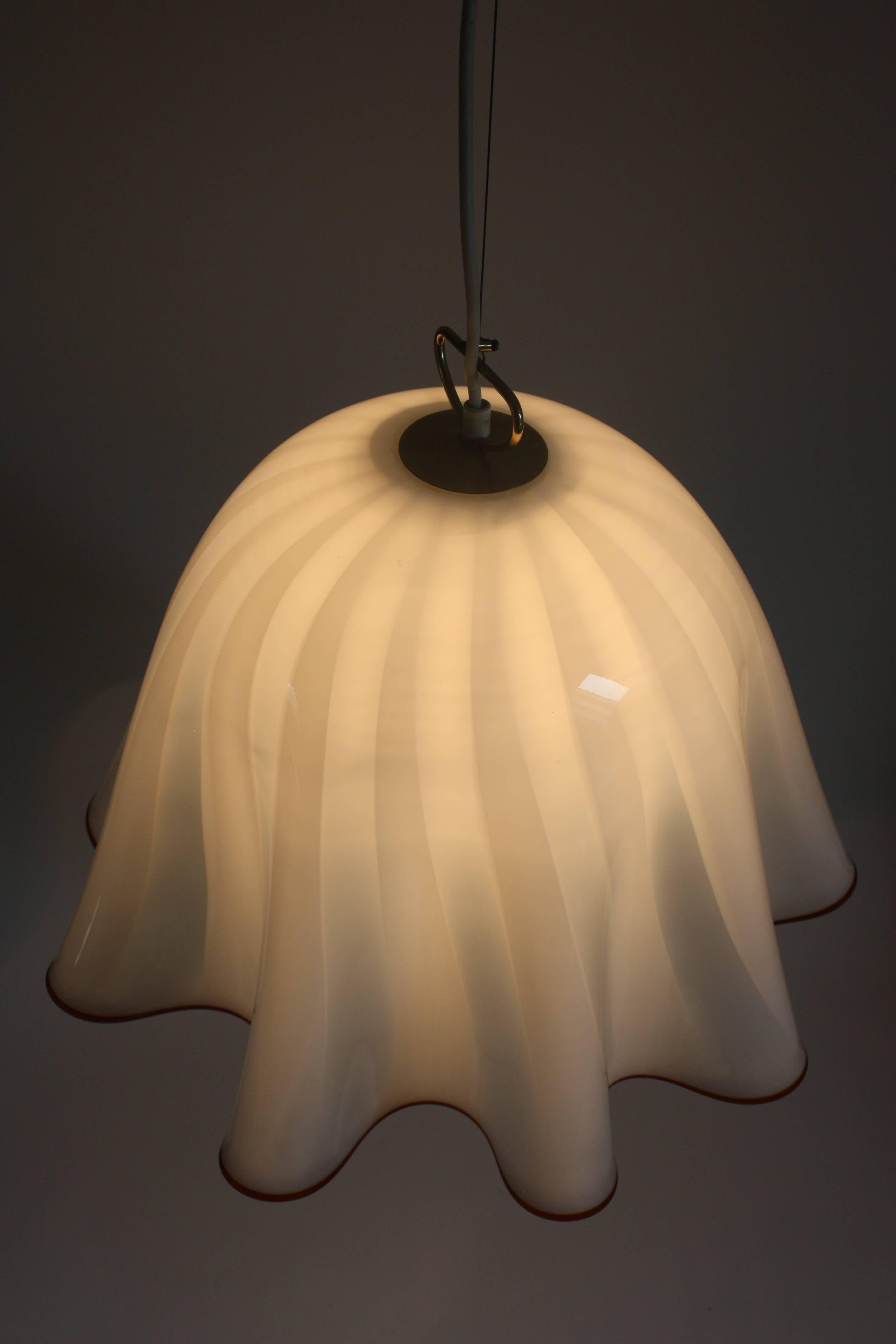 A beautiful extra large pendant by Kalmar, Austria, manufactured in Mid-Century, circa 1970s.
Murano glass and polished brass.
The total drop can be easily adjusted.
Dimension of a glass: 18.5 x 13.3
Socket: 1 x e27  for standard screw