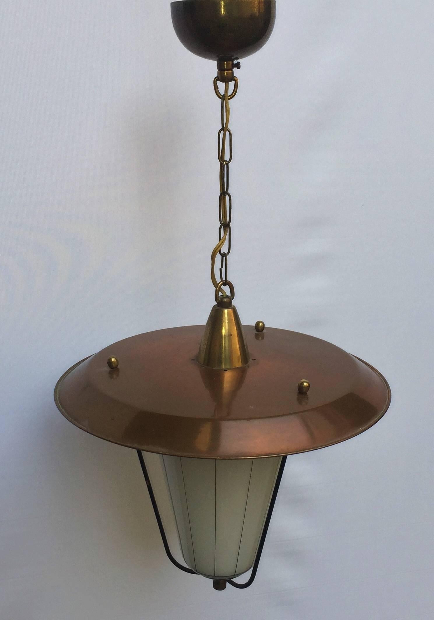 Beautiful midcentury one light hanging Lantern, Austria, circa 1950s.
Brass and copper frame and opaline glass shade with pinstripe decor.
Socket: one x e27 for standard screw bulbs.
Excellent condition.
 