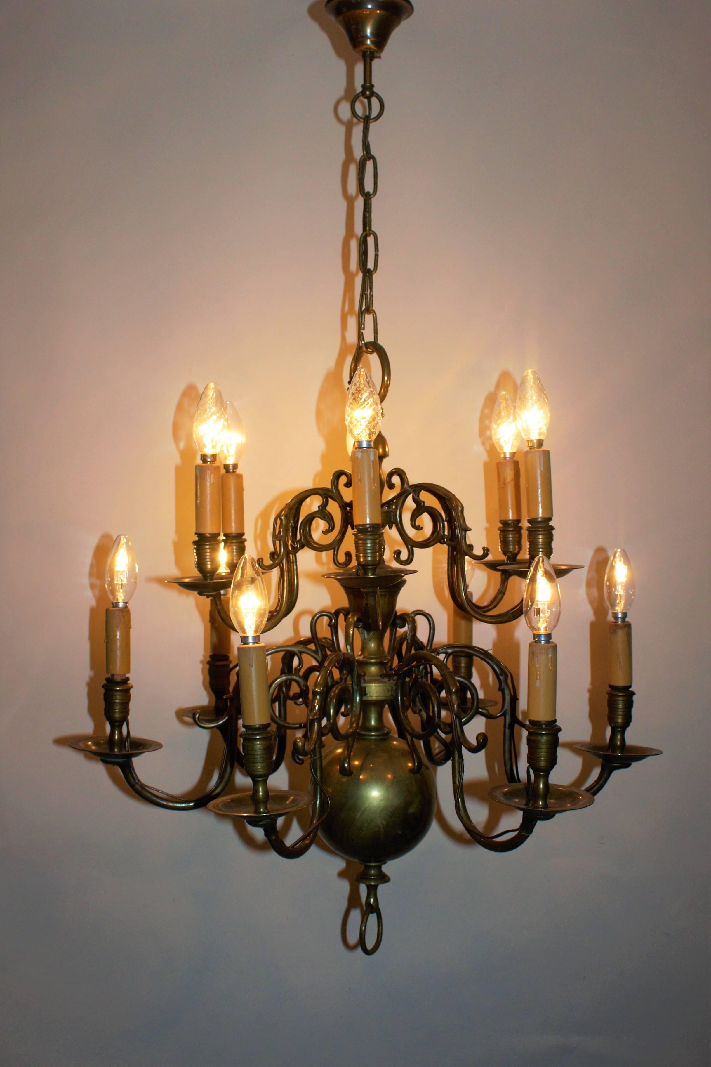 Two-tiered Dutch brass chandelier made late in the 19th century and recently wired for electricity.
Solid brass twelve - light frame with wonderful old patina.
Rewired for US and in very good original condition.
Socket: 12 x e 14 ( for standard