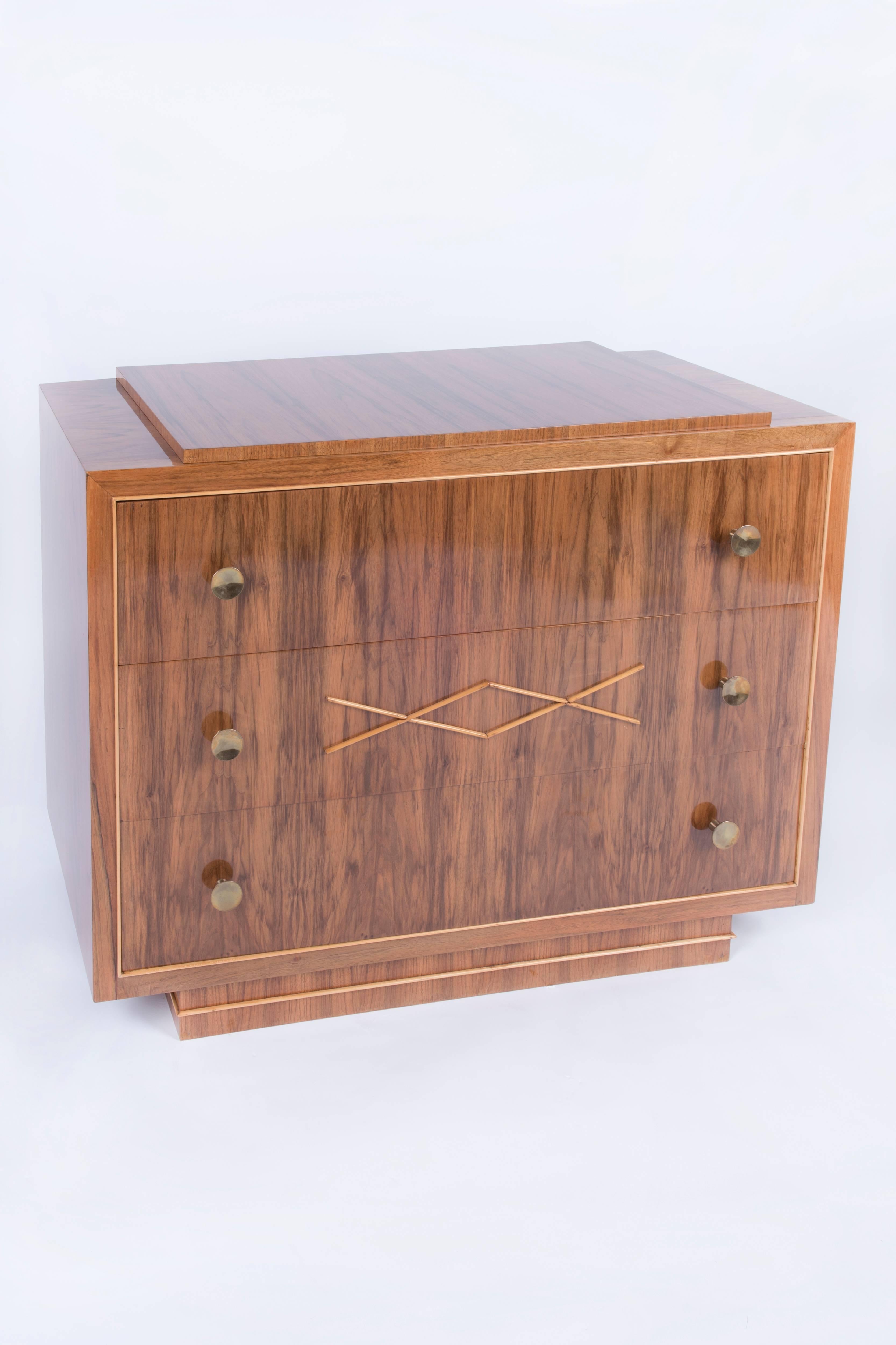 Walnut veneered, elegant Art Deco chest of drawers designed and manufactured by Josef De Coene en zon. Three big drawers with two brass handles on each.
The chest was restored and repolished with a lustrous handmade French polish, Belgian origin,