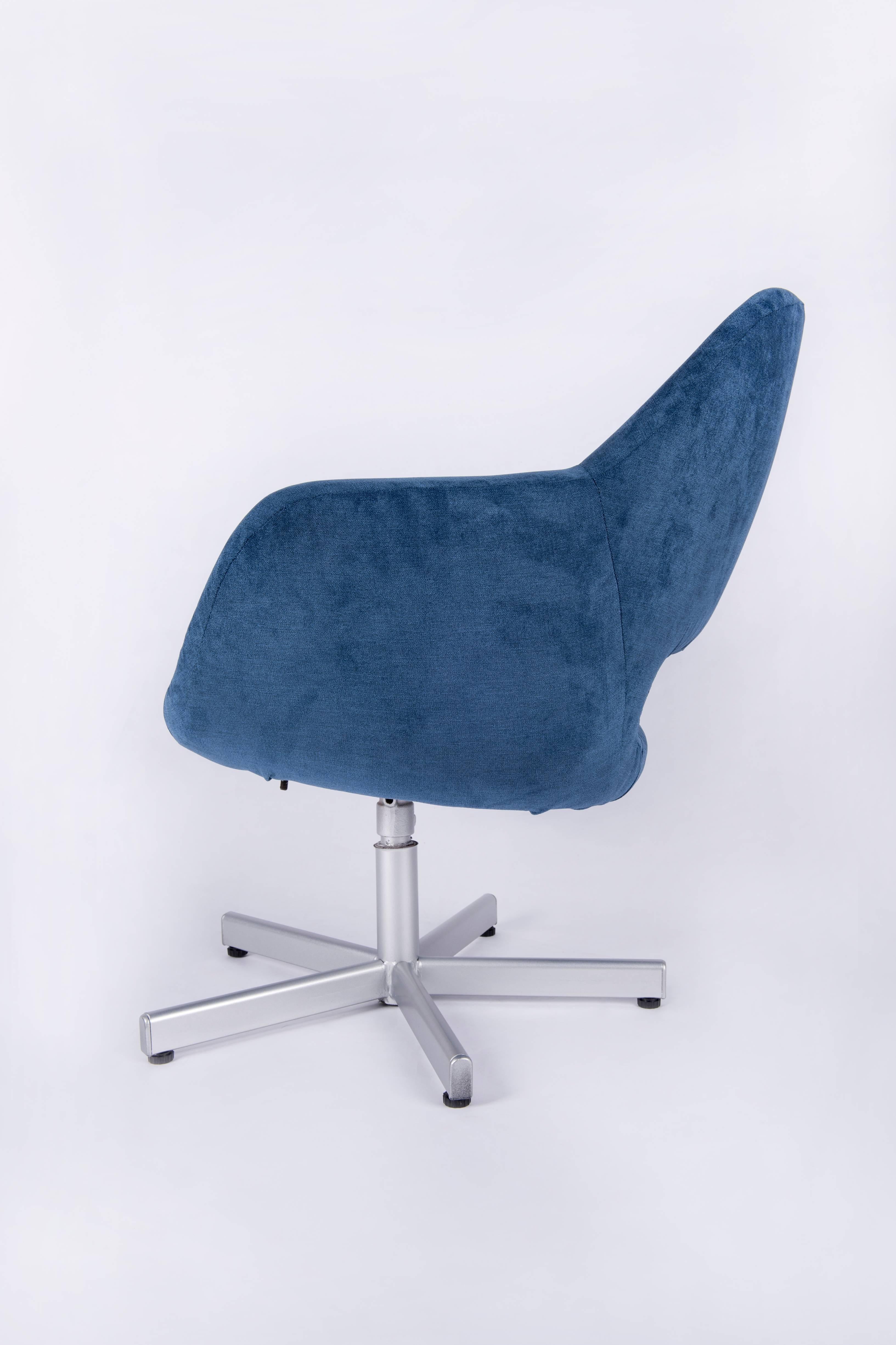 A pair of Mid-Century design swivel chairs. They were completely re-upholstered with a blue cotton fabric. The metallic feet were silver painted,
Germany,1960
Actually there is a set of four available. The listed price is for a pair.
 