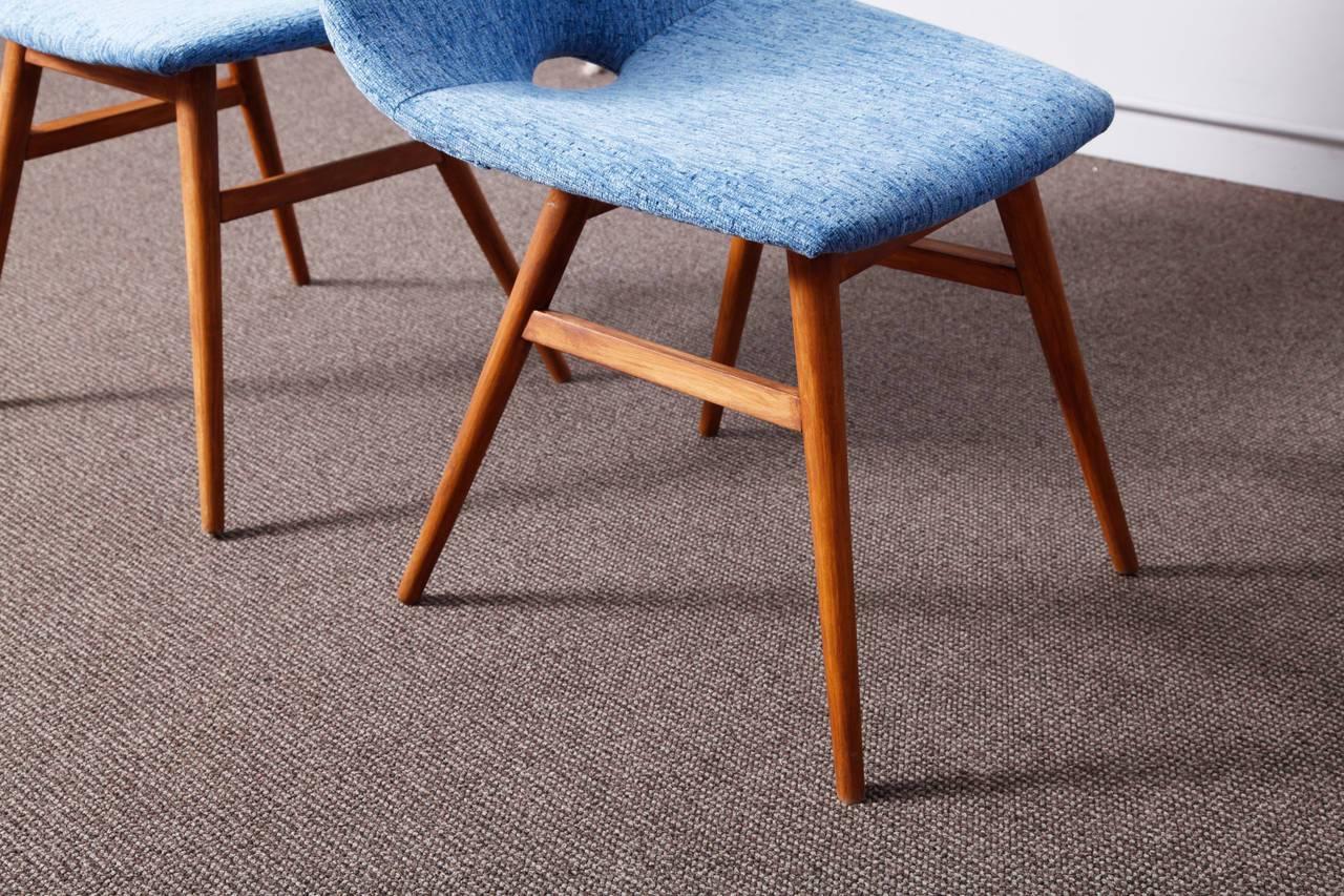 Burian Judit, Hungarian origin interior designer was inspired by the Scandinavian design of the 1950s. She designed the Erika chairs in 1959. A very elegant and comfortable model. The ashwood frame and the beautiful blue colored new upholstery make