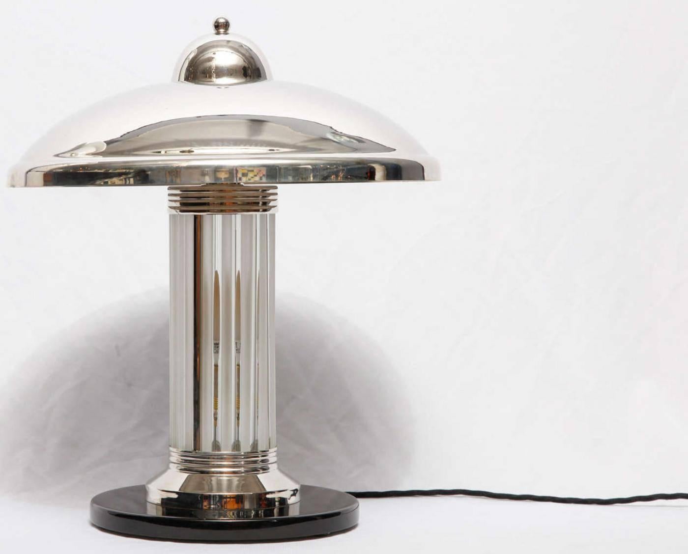 Pair of Art Deco table lamps designed by Petitot. Nickel-plated metal and glass.