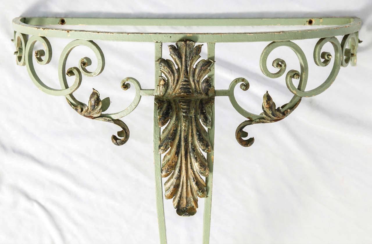 A pair of green and white painted forged iron console tables with glass top.The two pieces have not the same size, one is a bit smaller then the other.
Possible to make marble or glass top on demand, price on request.
The listed price is for two