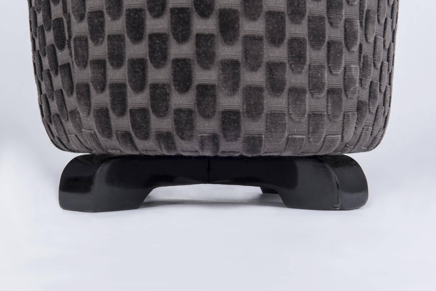 Art-deco foot-stool or ottoman.
Black lacquered wooden base, grey velvet upholstery.


 