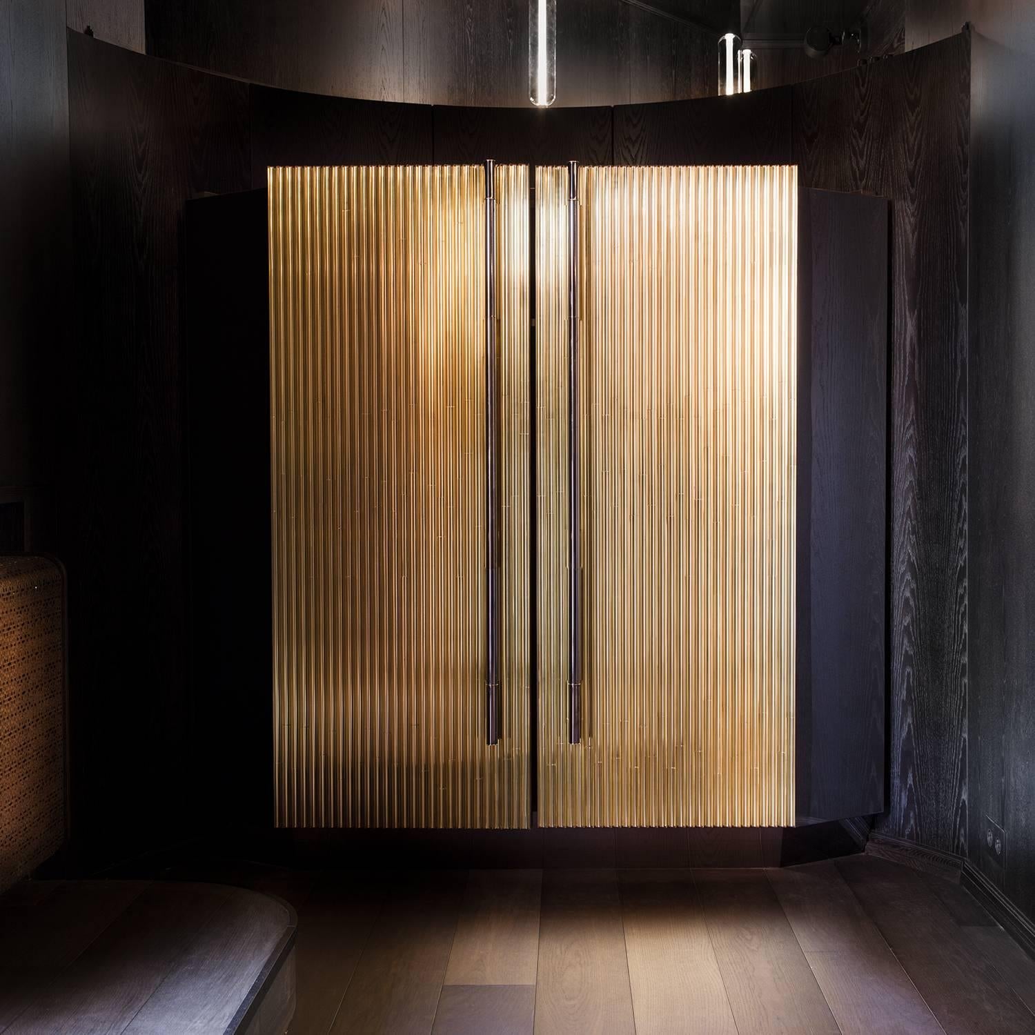 Trabo is a bespoke wooden cabinet with elaborately detailed brass doors created by Sors Privatiselectionem to meet your highest expectations of practicality and style.