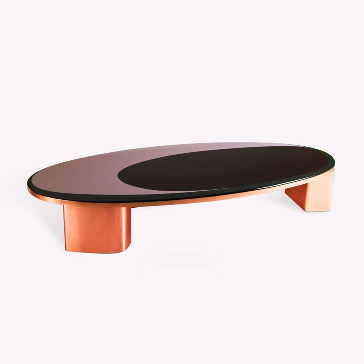 A perfect cocktail table to put you in the space oddity mood. The surface finish is made in resin and designed with a smaller over ring inside the larger oval design. The inner ring highlights sparkles in deep crimson tones which play well as a