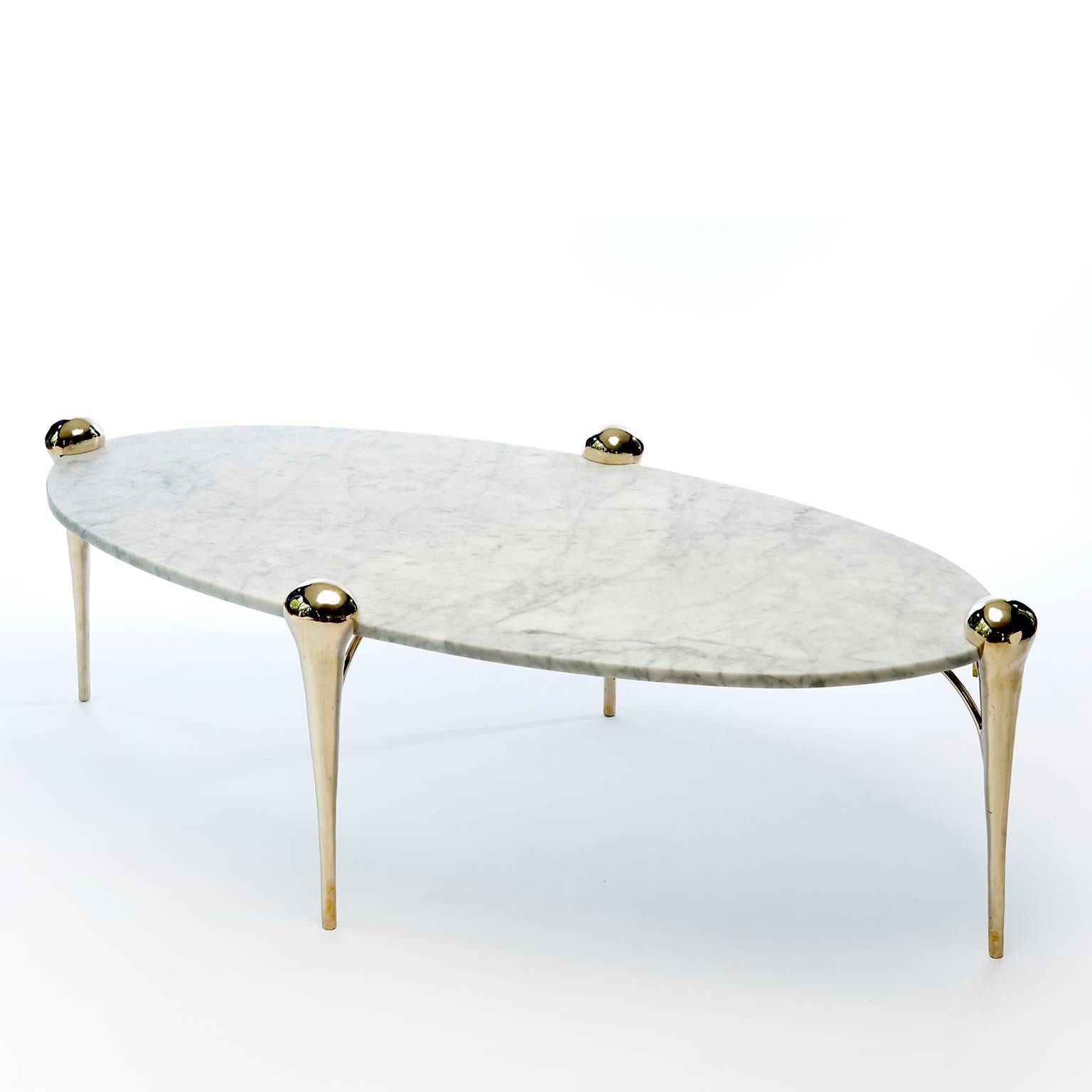 Holding the honed-marble tabletop, the sculpted cast bronze legs of the Petra coffee table resemble strong yet elegant legs of a camel. Designed by Helena Sultan, this piece embodies luxurious simplicity and harmony. Listed price excludes VAT.