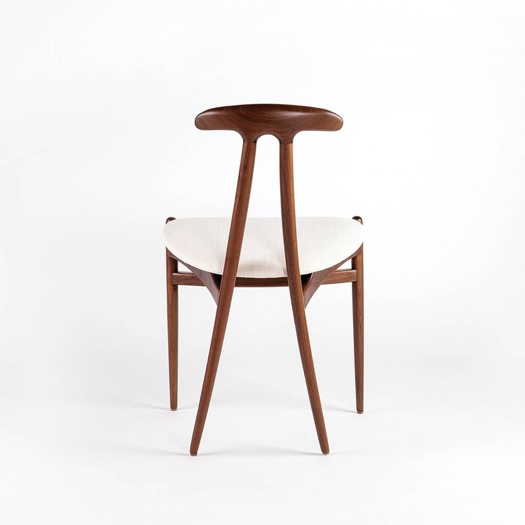 Bianca solid wood side chair is crafted by hand using mortise and tenon joints. This chair is equally ideal around a table or standing on its own.