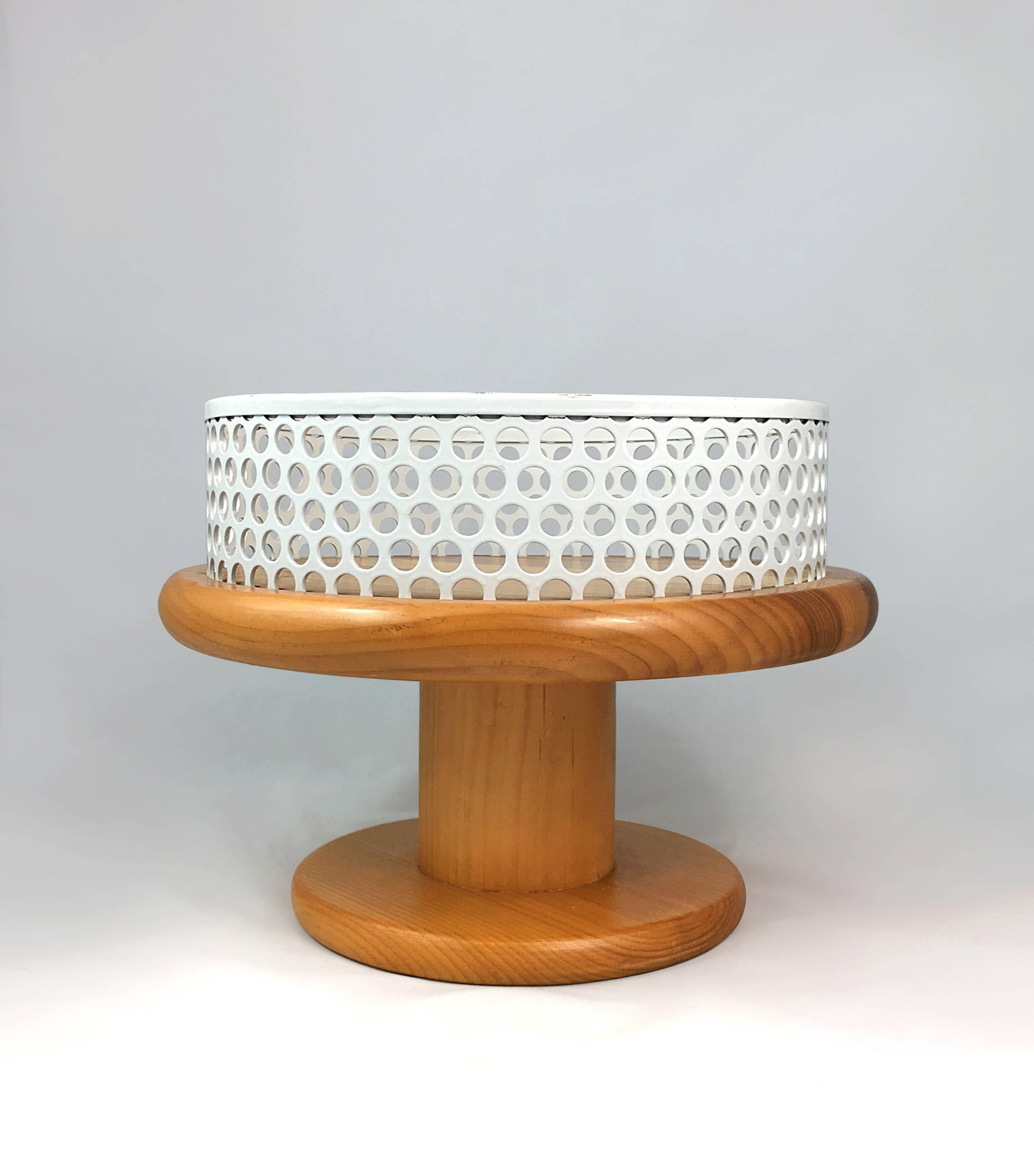 Fruit bowl on the polished walnut base with white perforated metal edge, designed by Ettore Sottsass. Manufactured by EAD, Italy.
Fire mark with designer's signature imprinted on the base.