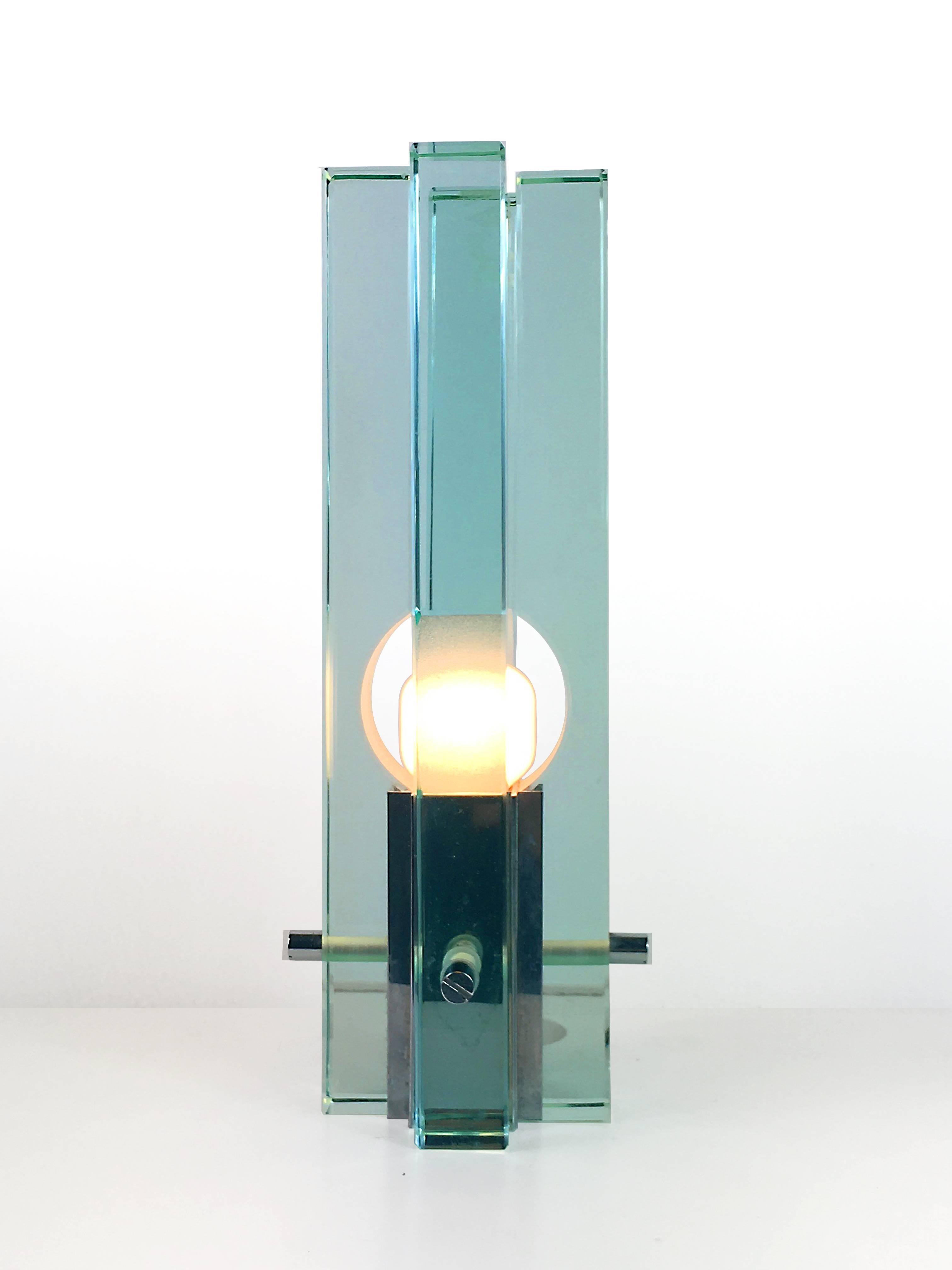 Elegant table lamp of glass, with centre placed lamp.