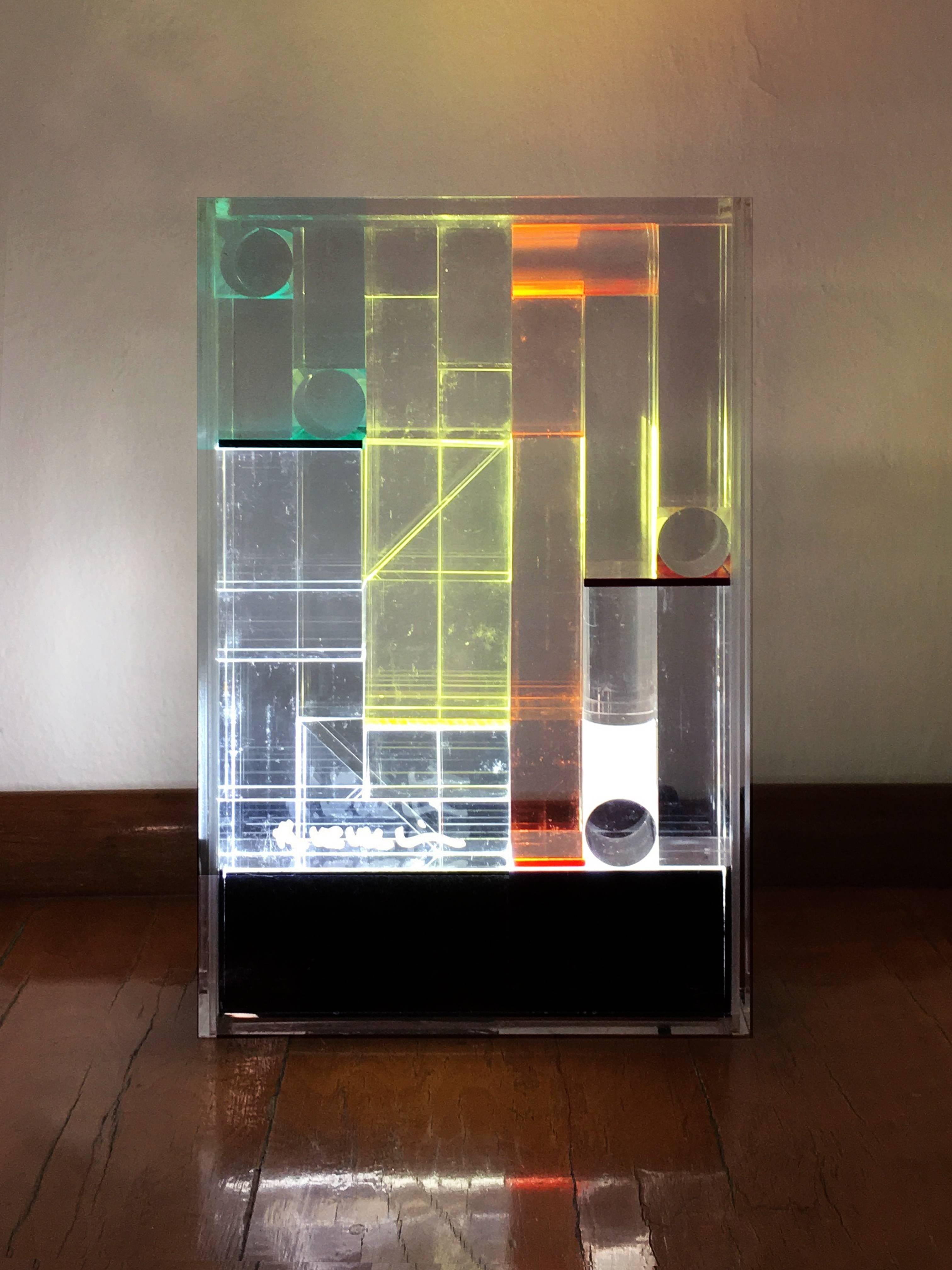 Lamp in methacrylate with light-box base, set of colored filters and clear prisms with different arrangement. Designed for Lamperti. Possible to verify the position of prisms and filters and obtain the effect of lights and colors.

Lamp: