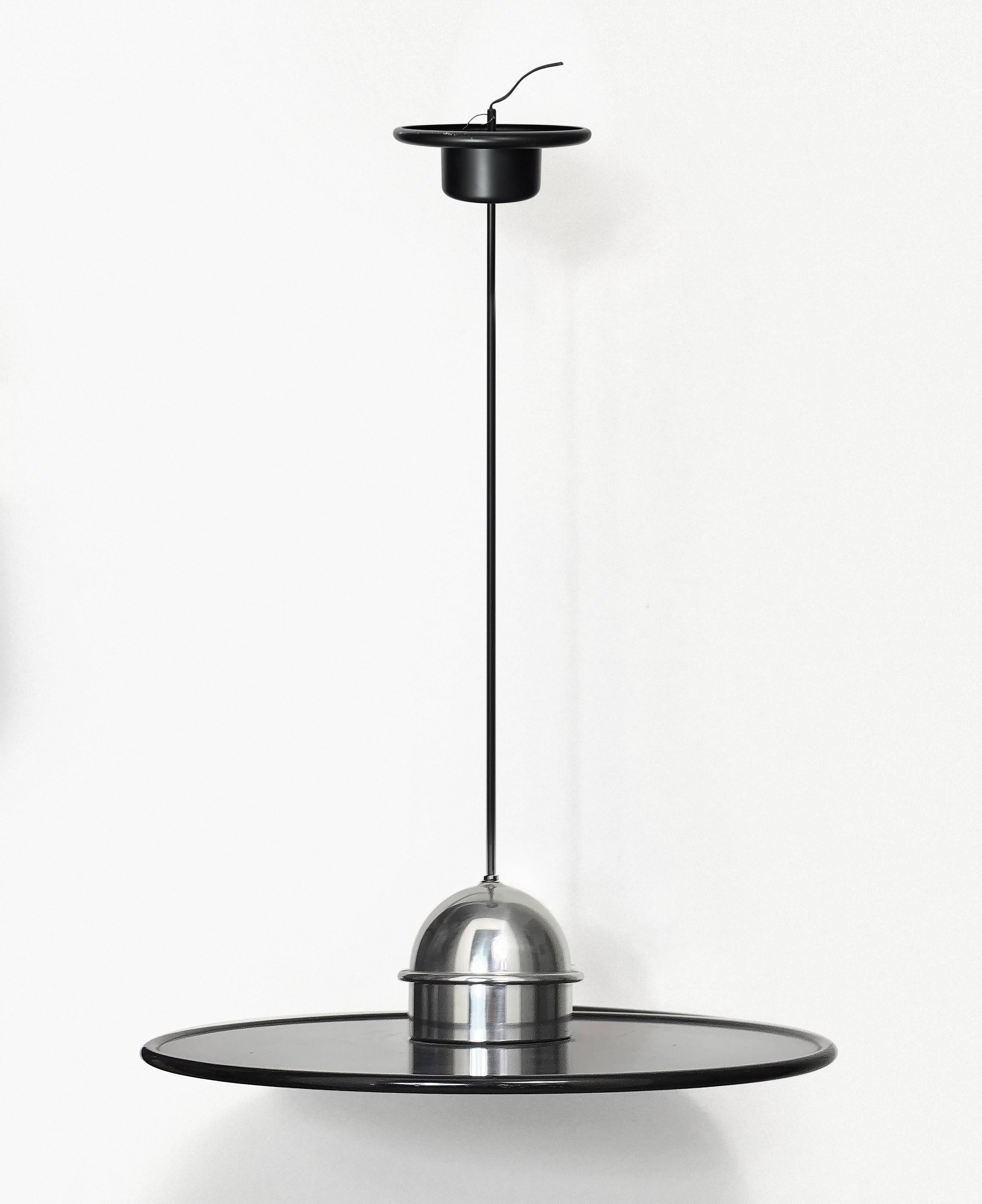 Metal ceiling lamp designed by Ettore Sottsass, produced by Stilnovo. Made of black enameled metal and polished aluminium. Marked with label sticker. The upper part of lamp was restored.