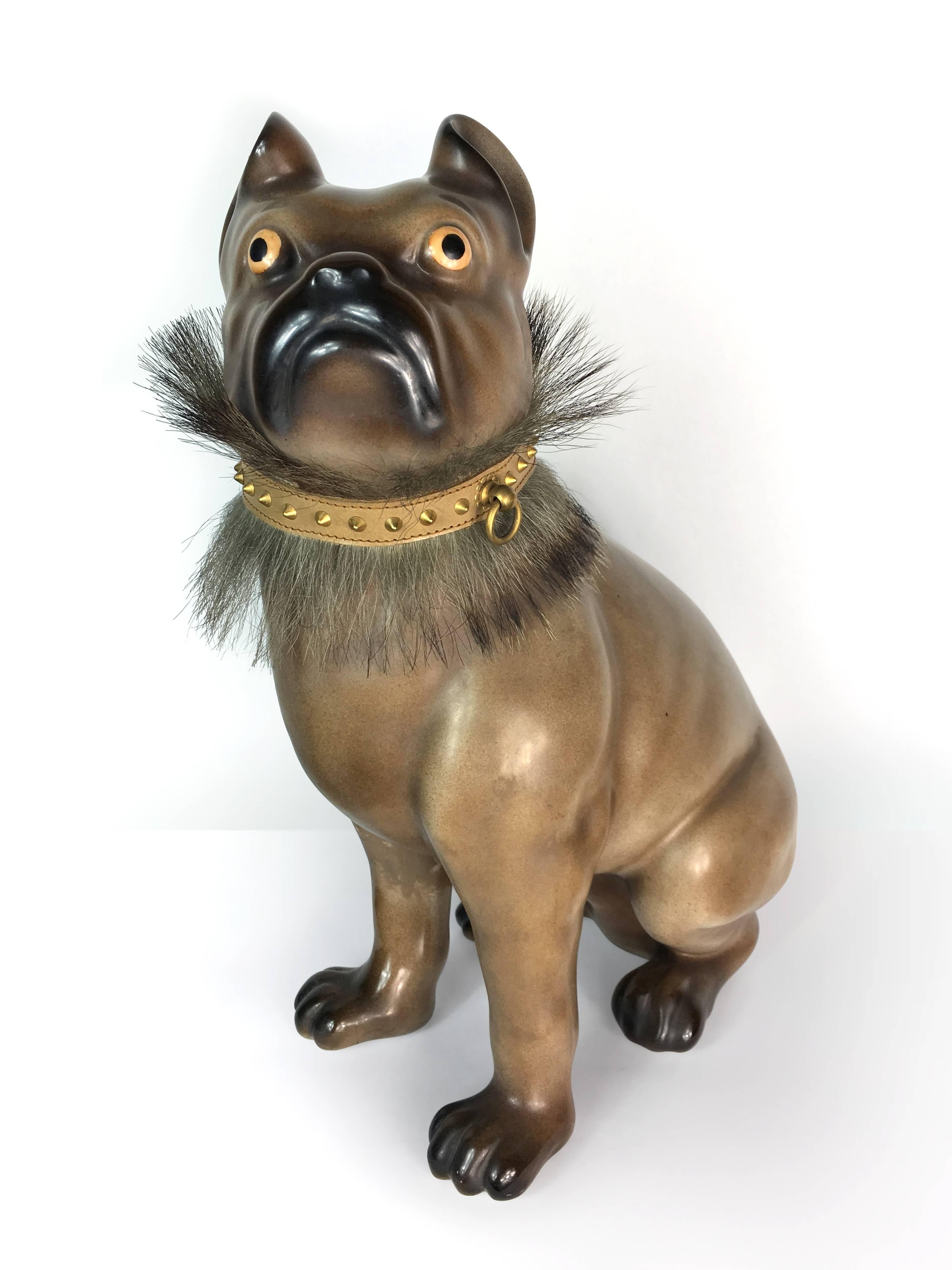 Piero Fornasetti original bulldog porcelain figure. Made in 1950s in Italy, the figure has leather collar with metal and fur embellishment. Down the back of the dog stored the original stamp of manufacture. The right front leg was restored by the