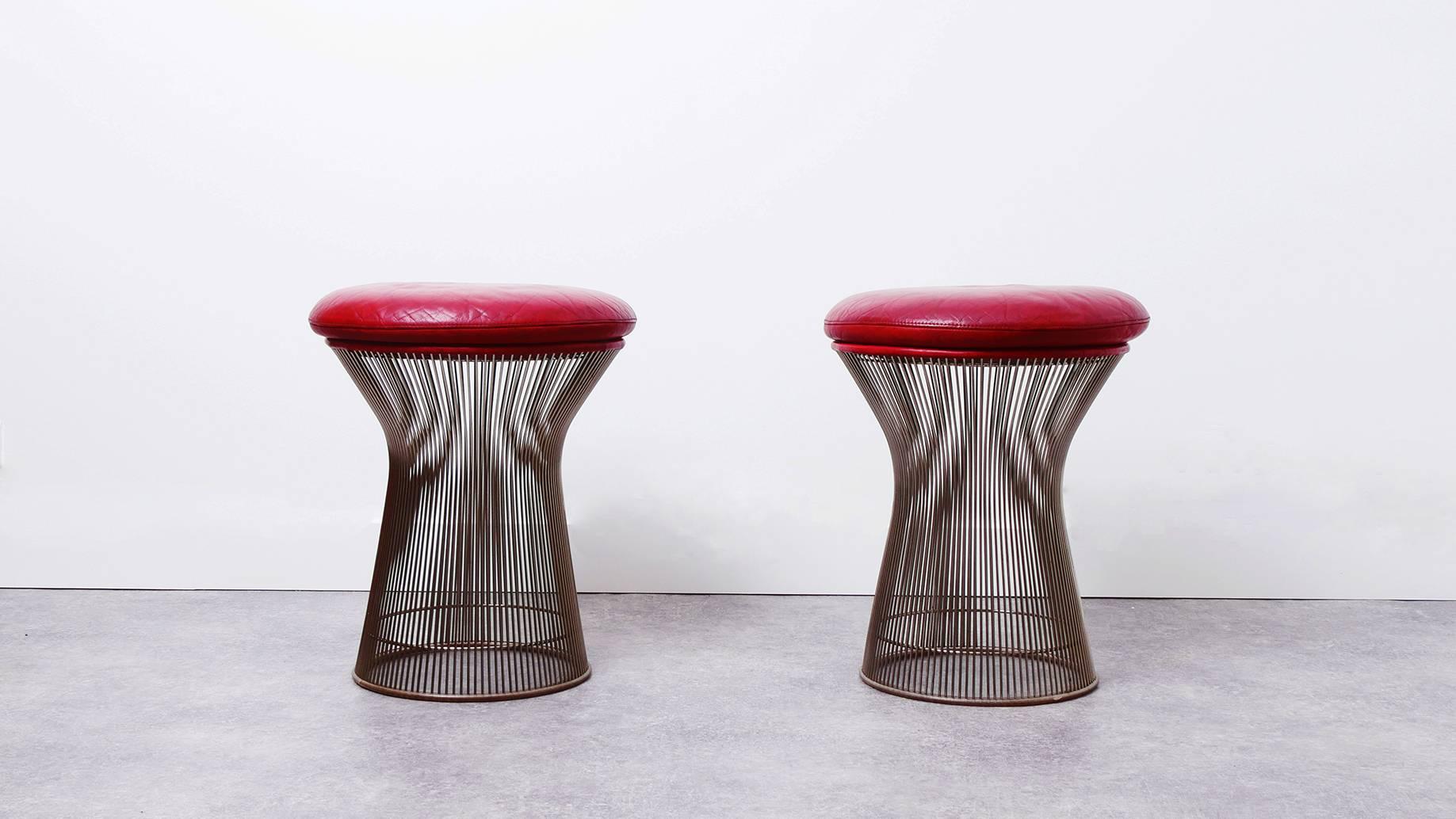 Beautiful pair of stools by Warren Platner for Knoll Internation in very good condition with original red leather and detachable cushions.