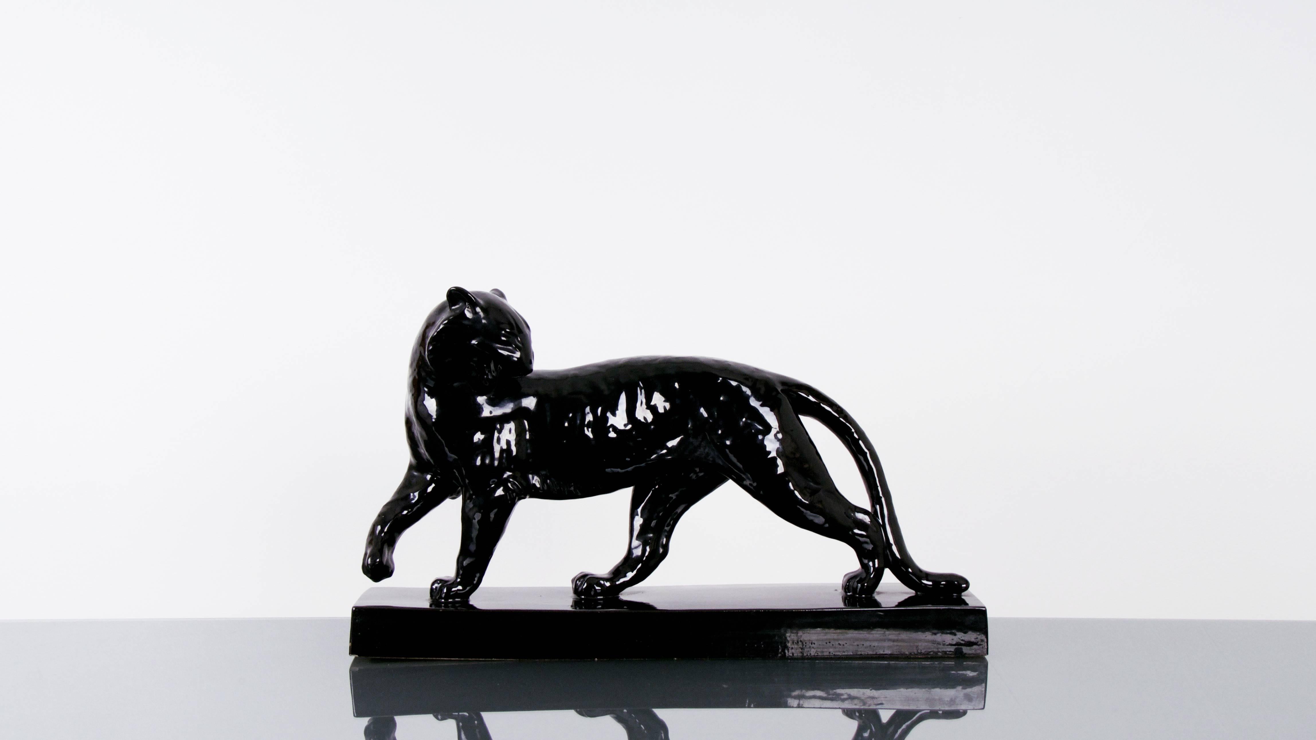 A black panther in glazed ceramic made by Alexandre Kelley and Marcel Guillard. Signed and stamped.