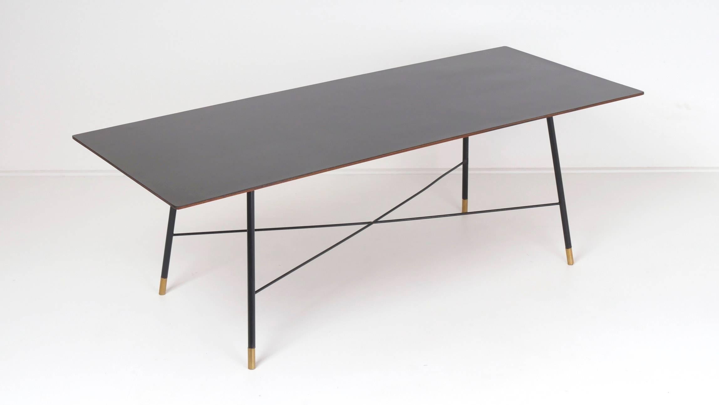 Ico Parisi rectangular coffee table for Cassina, circa 1950 in hard wood, painted steel, formica and brass. This very elegant table is in excellent condition.