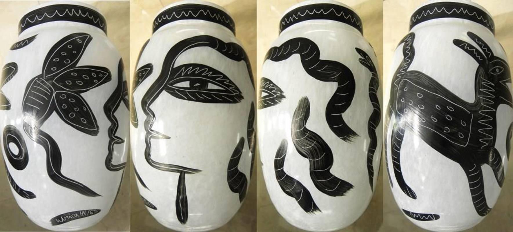 Sublime pair of white and black vases by Swedish artist Ulrica Hydman Vallien (1938).
Kosta Boda's glass manufacturer, circa 1990
Hand-painted, Signed and numbered.
 
About the artist :
Ulrica Hydman-Vallien has reached a wide public through