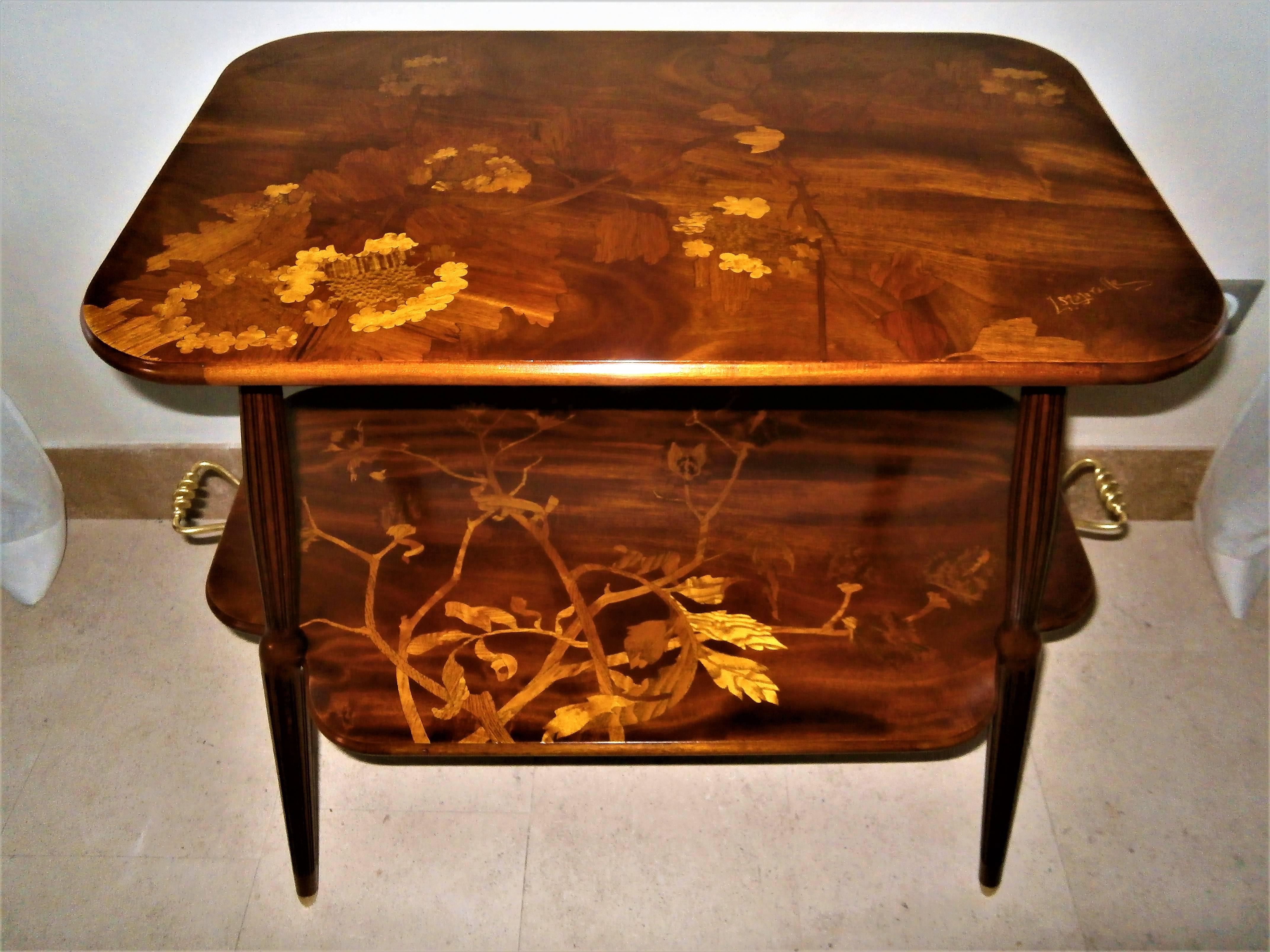 Signed by Louis Majorelle, this unique French Art Nouveau marquetry table featuring leaves and flowering berce des près.
Nancy, France, circa 1900.
Handles and legs sabots in gilt bronze.
Excellent restored antique condition.
Dimensions: 90 cm x