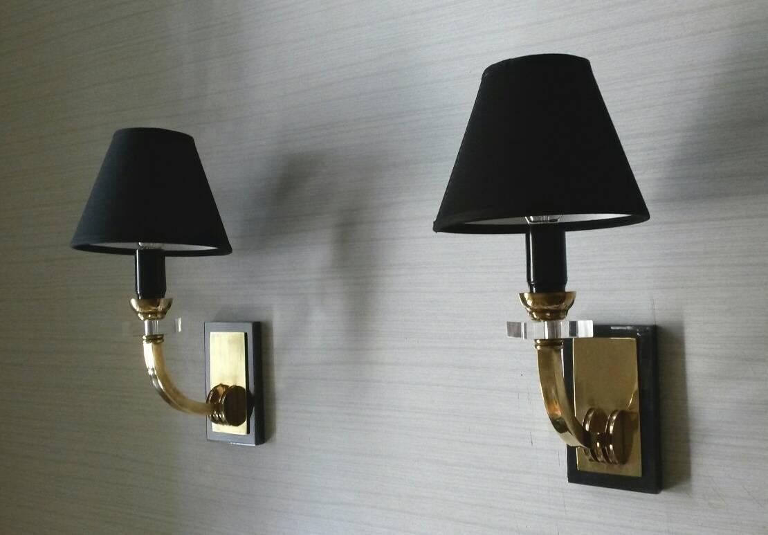 Extremely elegant pair of neoclassical style sconces, by Jacques Adnet, France, 1950s
Made in gilt bronze with canon de fusil patina (metal gun) glass and black cotton lampshades.
New wired and suitable for US standards. 




     