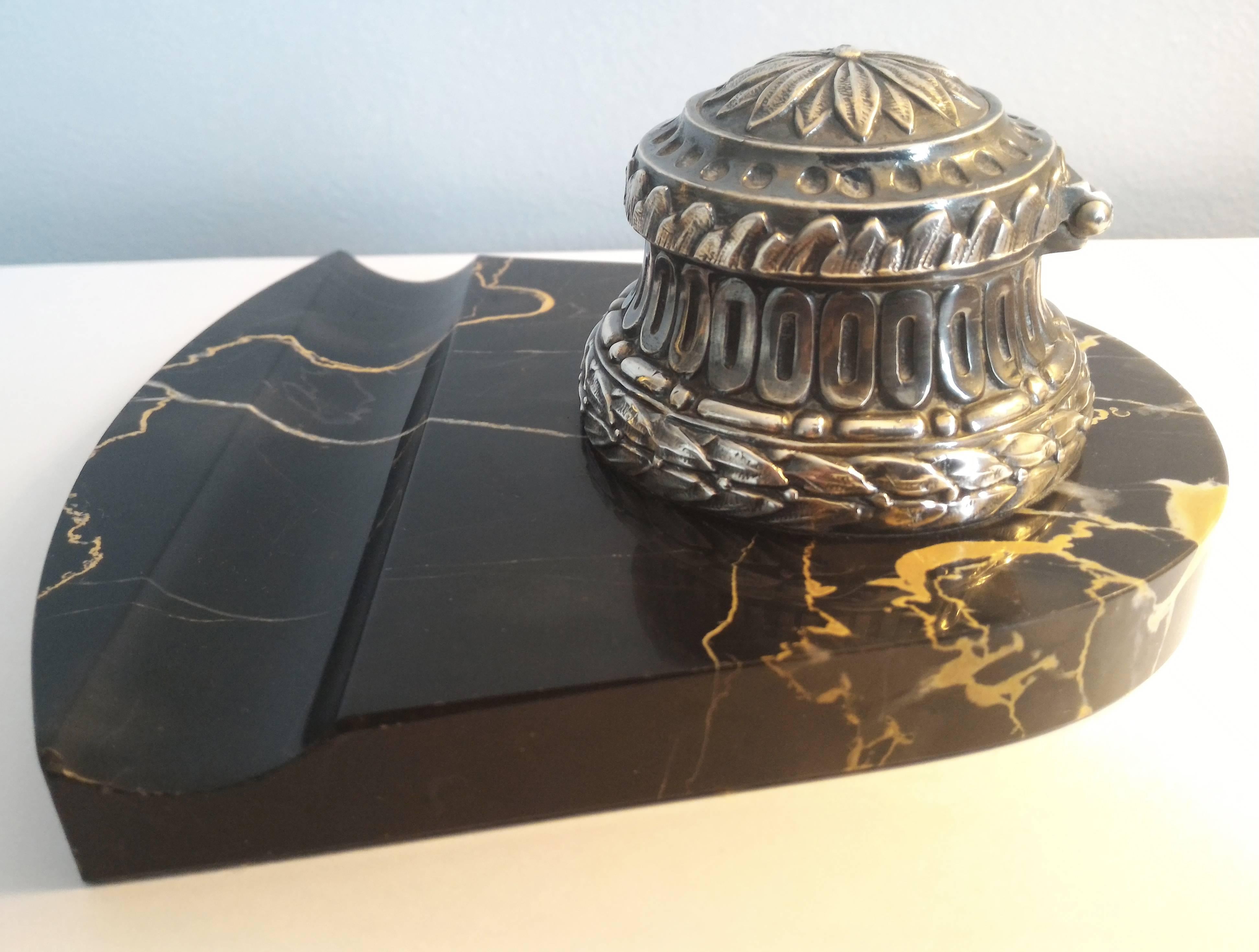 Extremely Chic black and gold portor marble base inkwell portor marble and silver metal Inkstand with two buckets.

Portor marble is a very rare marble quarried in Italy and in Corsica and sometimes found in France, but very sparingly. It is known