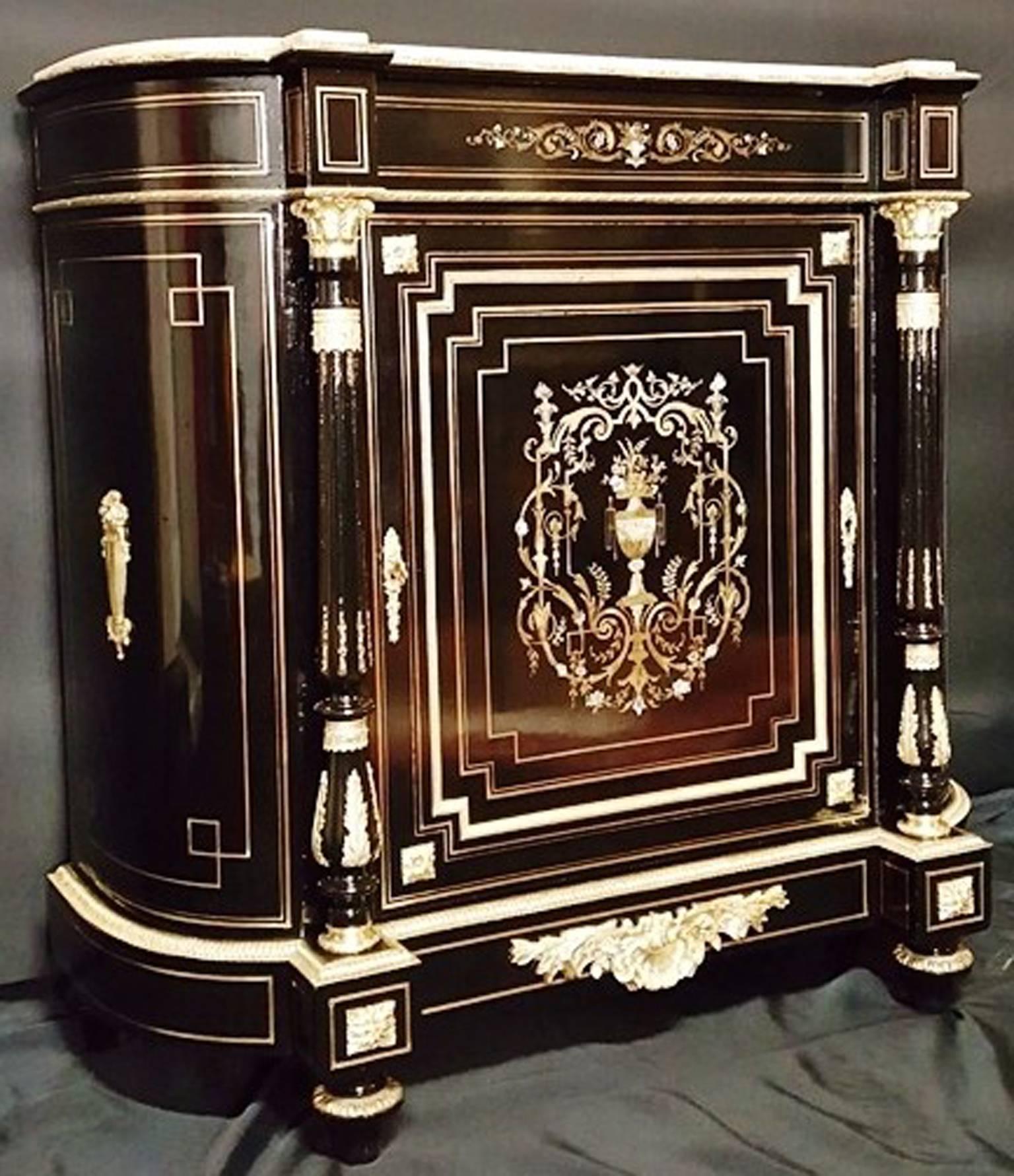 French curved cabinet in Boulle brass inlaid marquetry with scroll work, leaves and tracery ornamental motif. 

Marquetry in three different materials: mother-of-pearl, bone and brass. Wonderful and important ornamental of gilt bronzes with