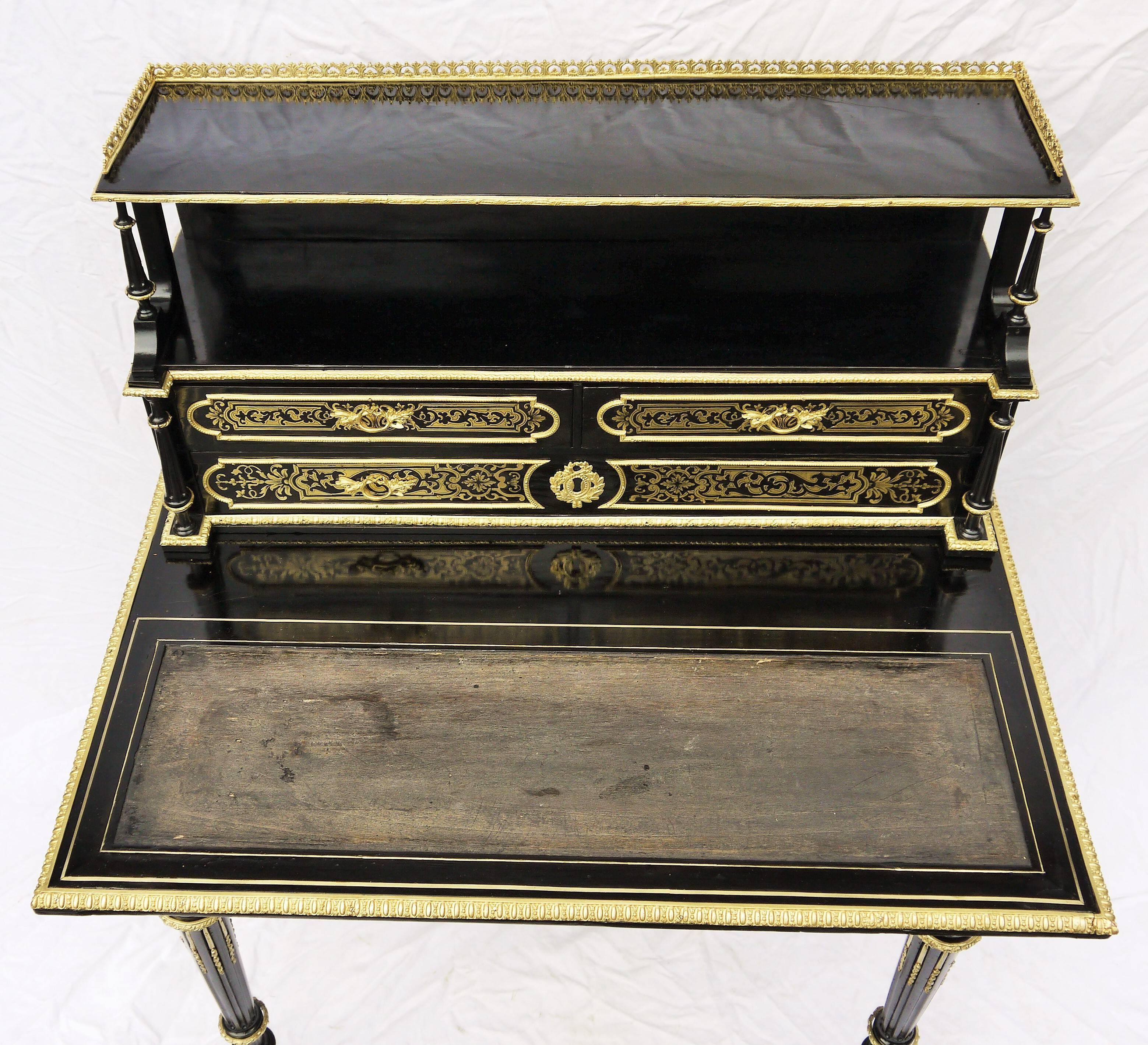Unique, rare French bureau à gradins desk, Boulle style marquetry with brass on the drawers.
Many delicate bronze adornments everywhere that adds elegance and beauty, even on the small columns. A spacious facade drawer and three other ones on the
