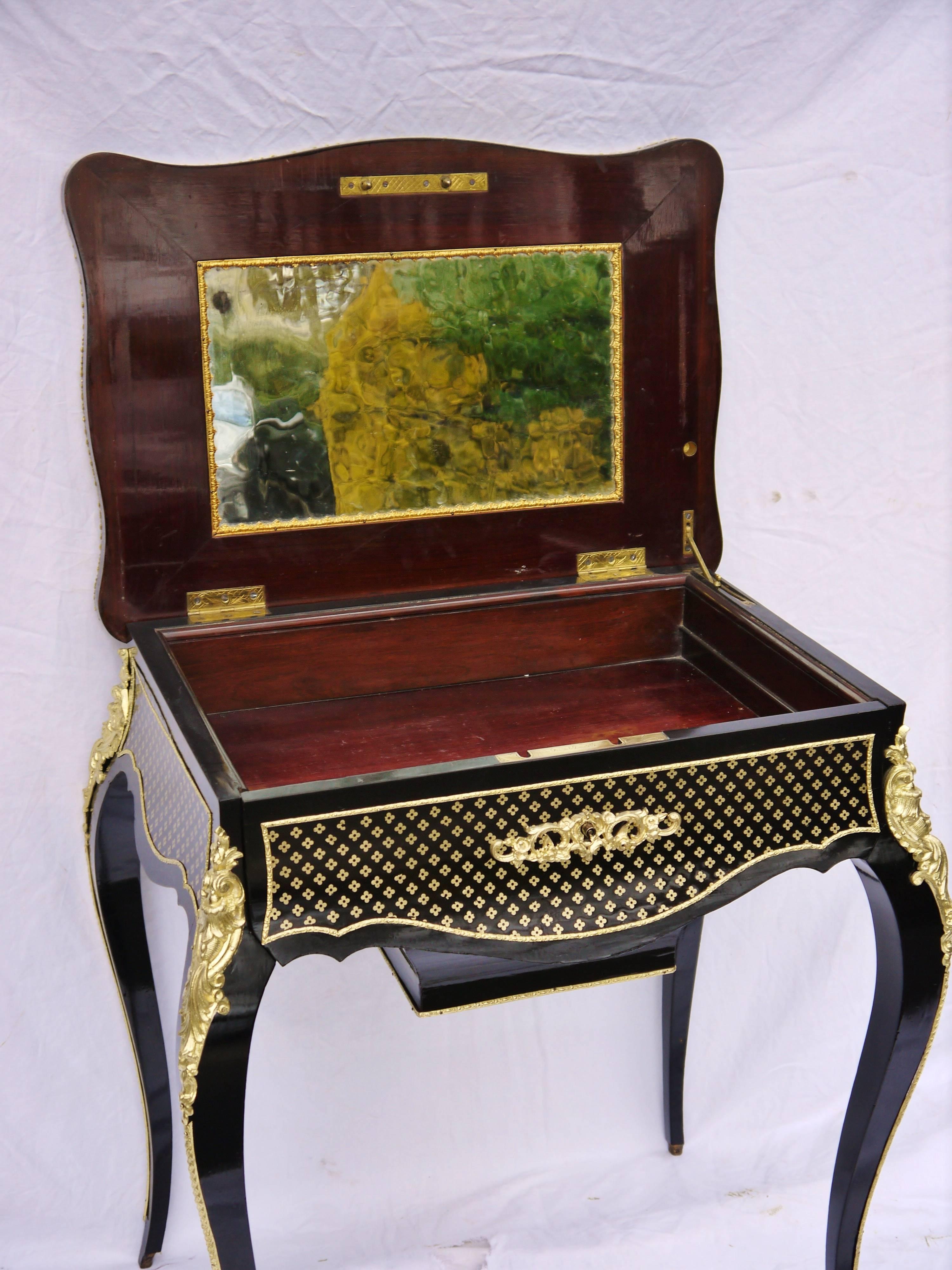 
Charming 19th century, Louis XV Style, Ebony Boule Marquetry Travailleuse Side Table in Ebony veneered and Boule style marquetry 