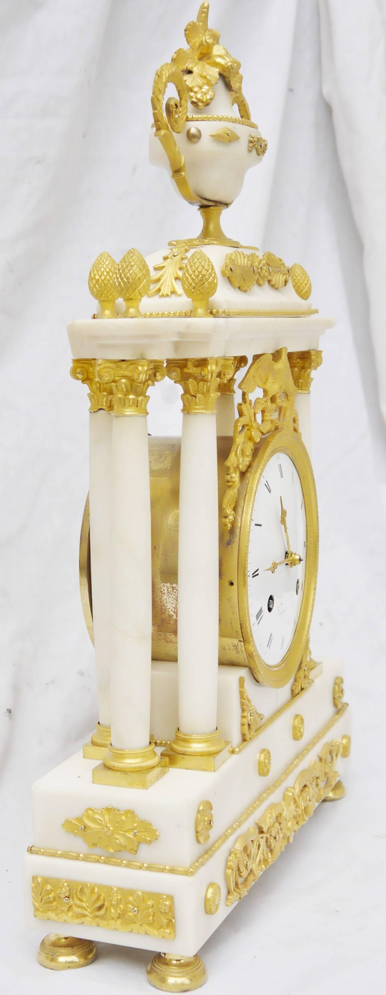 Unique and refined Carrara marble table clock lock, gilt bronze ornamentation, golden by posing gold with mercury, all over it, including its clock hands. Astonishing movement disposition by that time, with six columns:

Paris suspension wire