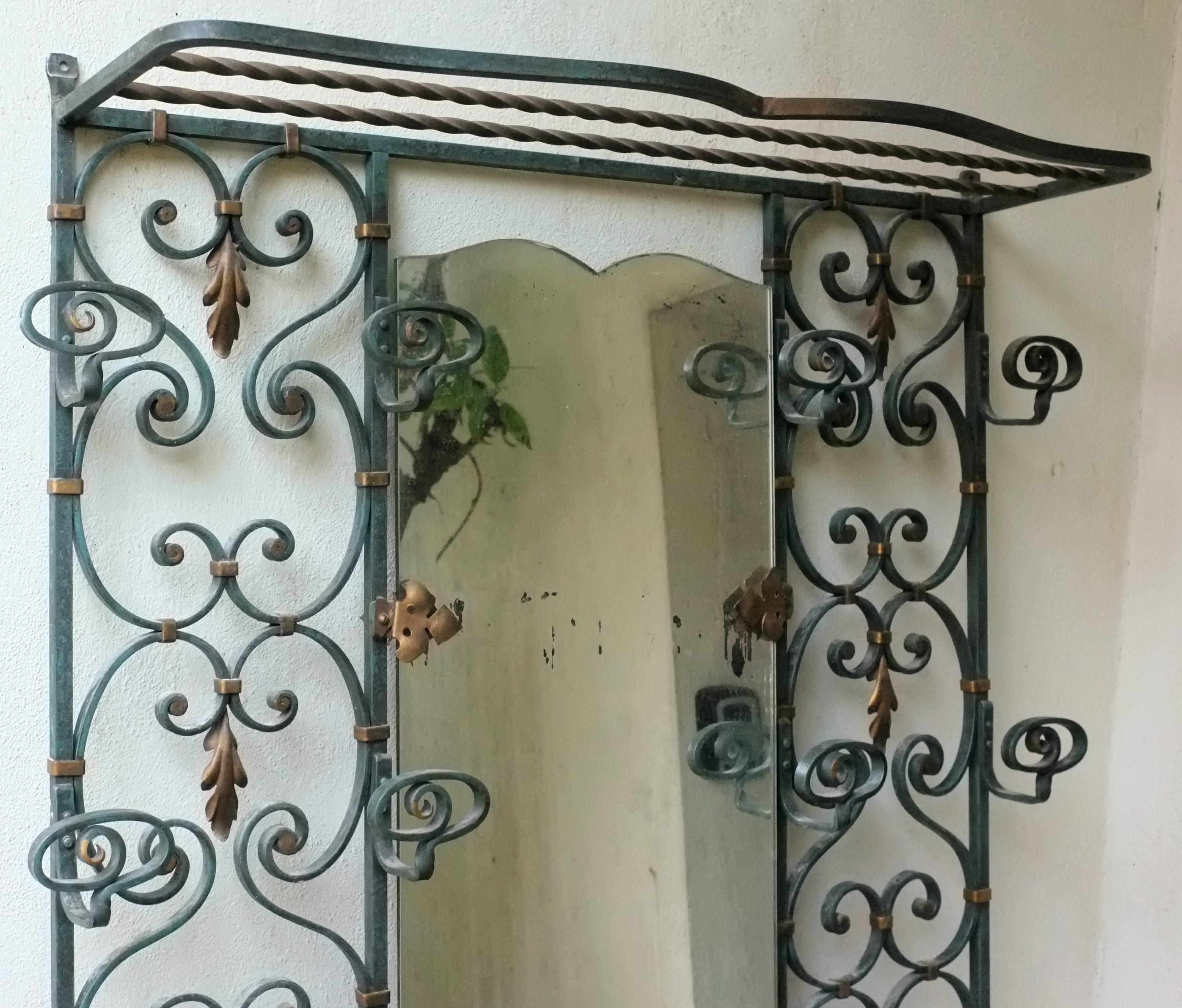 Charming French wrought iron Mid-Century style, coat hanger, mirror and umbrella stand

circa 1950, France.

Dimensions: 
height 183 cm 
width 81 cm
depth 20 cm.
 