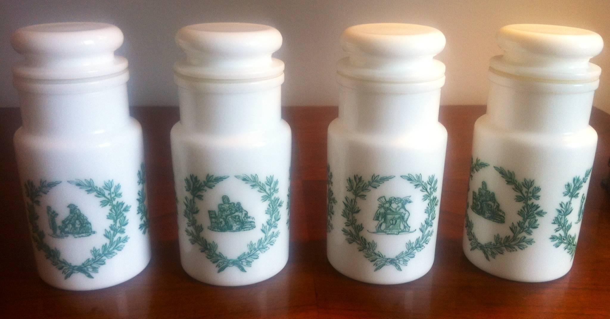 Complete Italian white opaline jars set, 10 Pieces in white color and green and blue ornaments. Basically they were pharmacy jars and then they were used as bathroom or kitchen jars decoration.

Two big size jars dimension: Size 22 cm height and