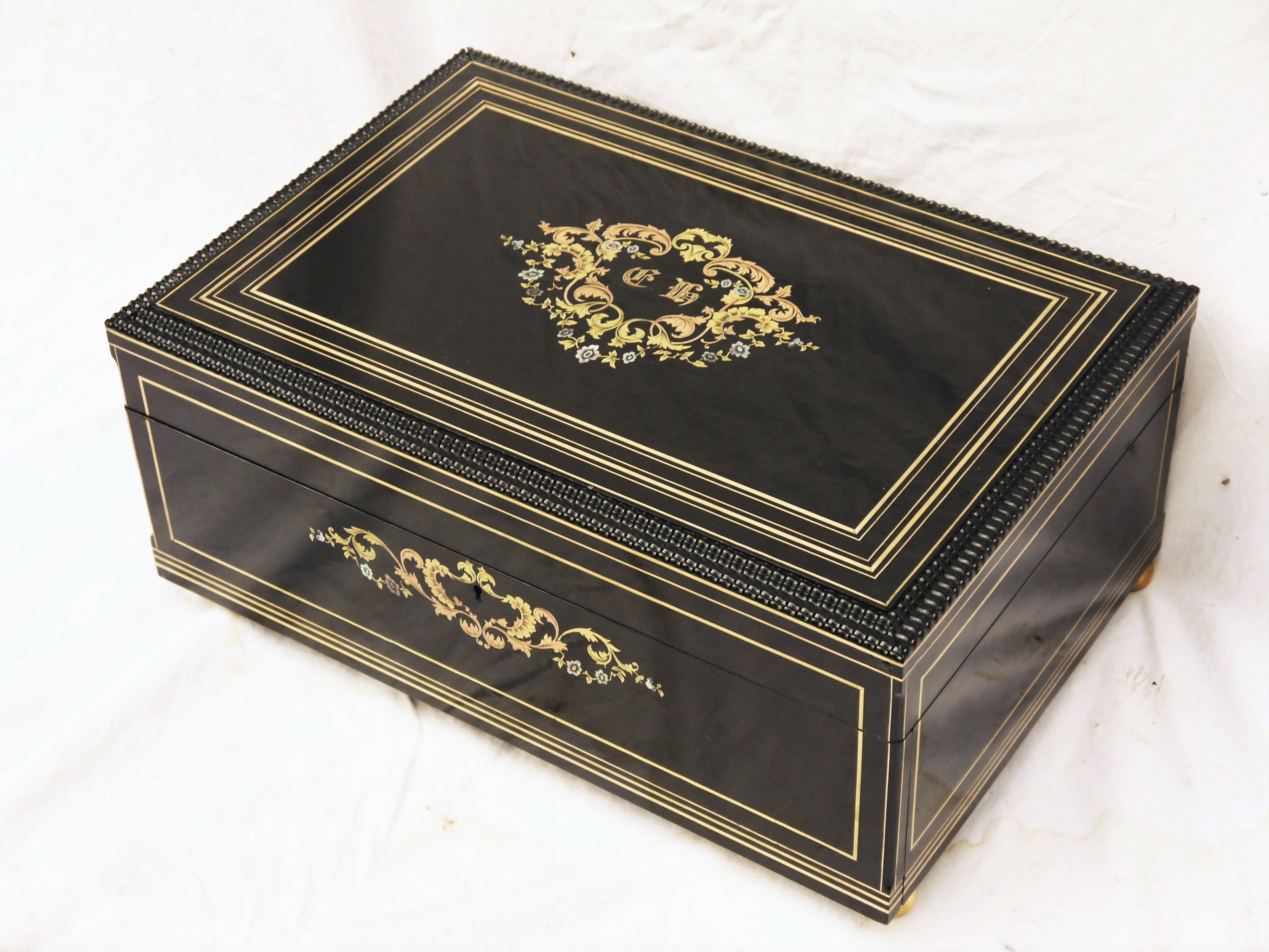 Large Size Napoleon III Charles style box in Boule style Marquetry with fine and delicate brass, copper and burgau mother-of-Pearl ornaments.

Monogrammed Medallion in the outside part. 
The inside part is covered with mahogany and fine double
